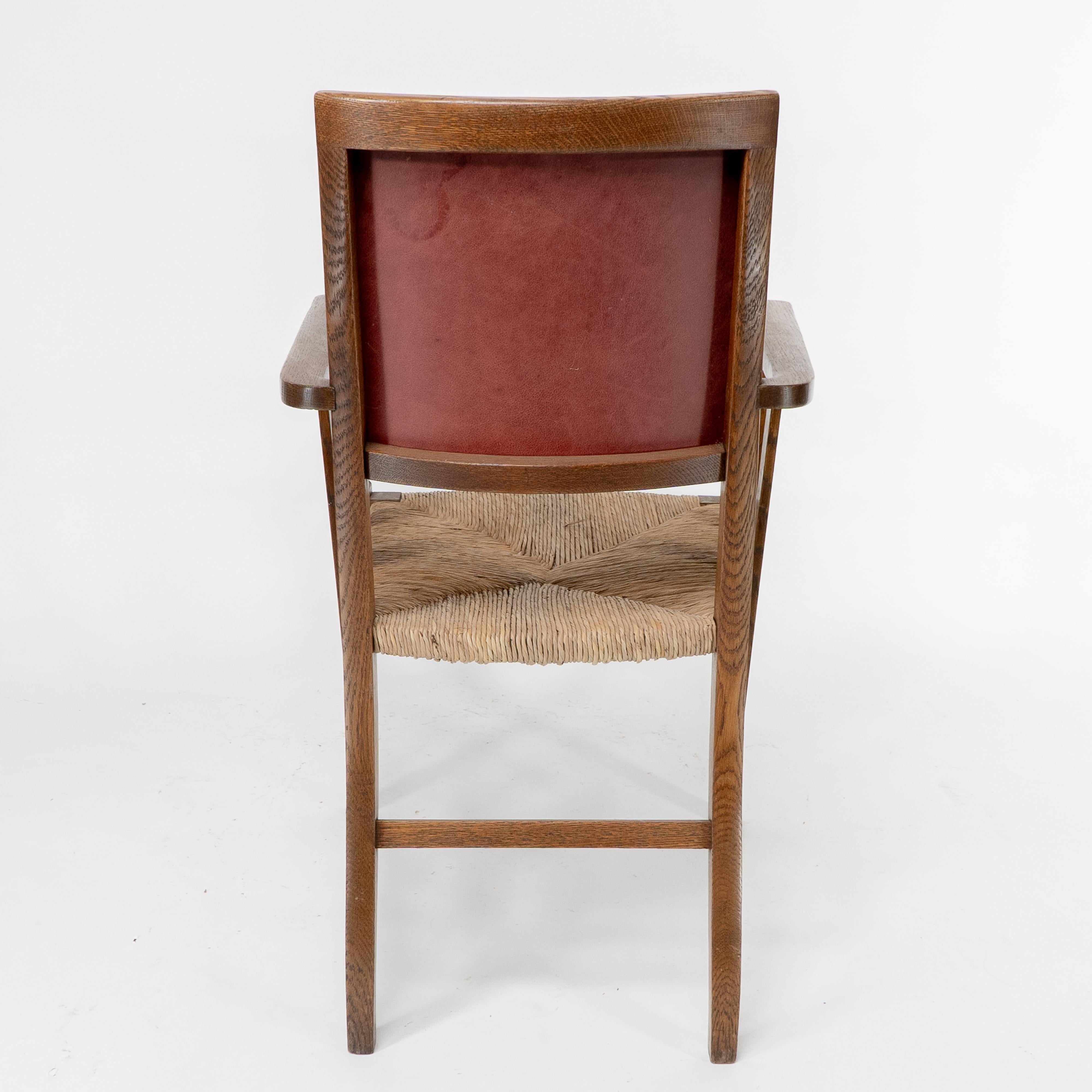 Liberty & Co. An Arts & Crafts rush seat armchair with a shaped back For Sale 12