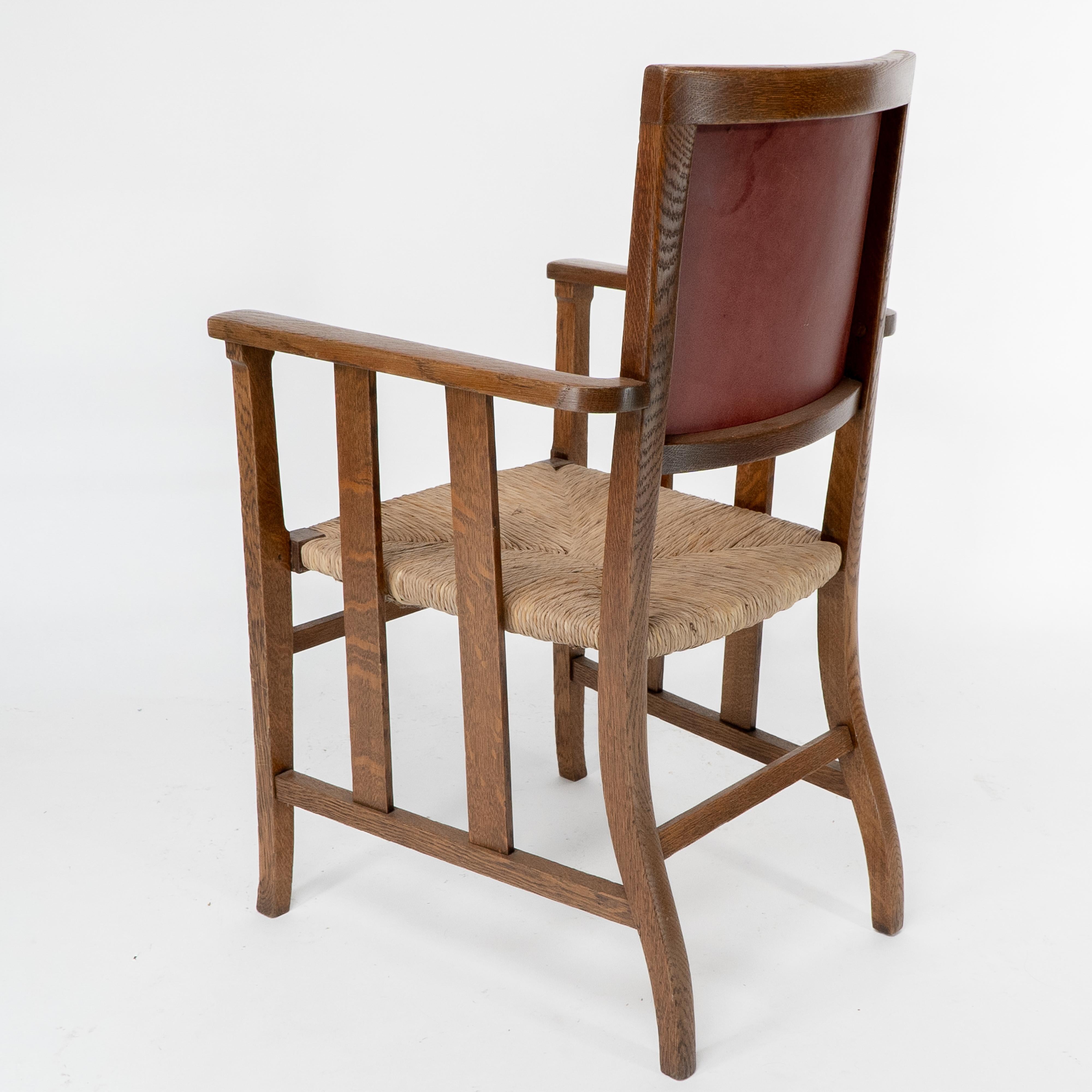 Liberty & Co. An Arts & Crafts rush seat armchair with a shaped back For Sale 13