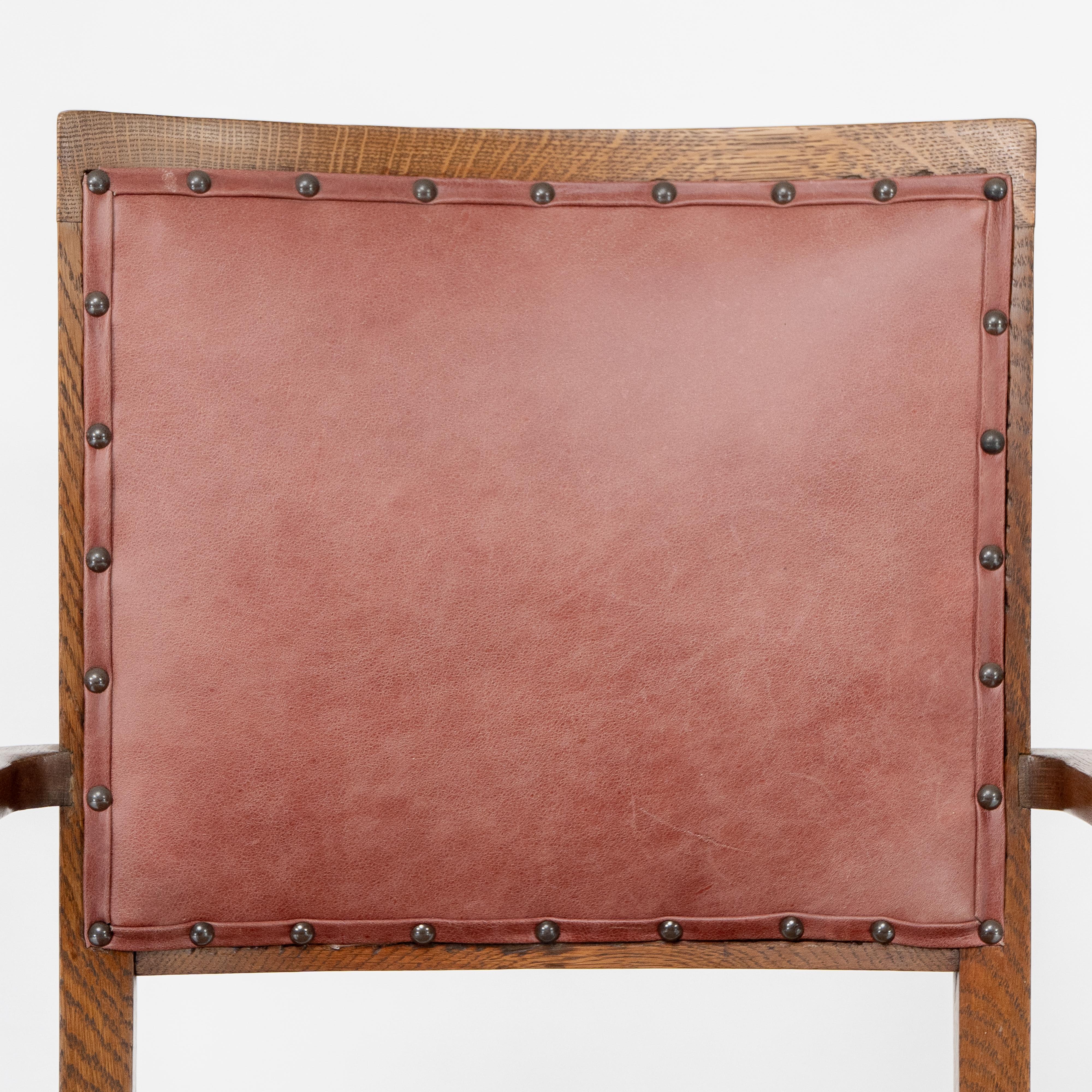 Early 20th Century Liberty & Co. An Arts & Crafts rush seat armchair with a shaped back For Sale