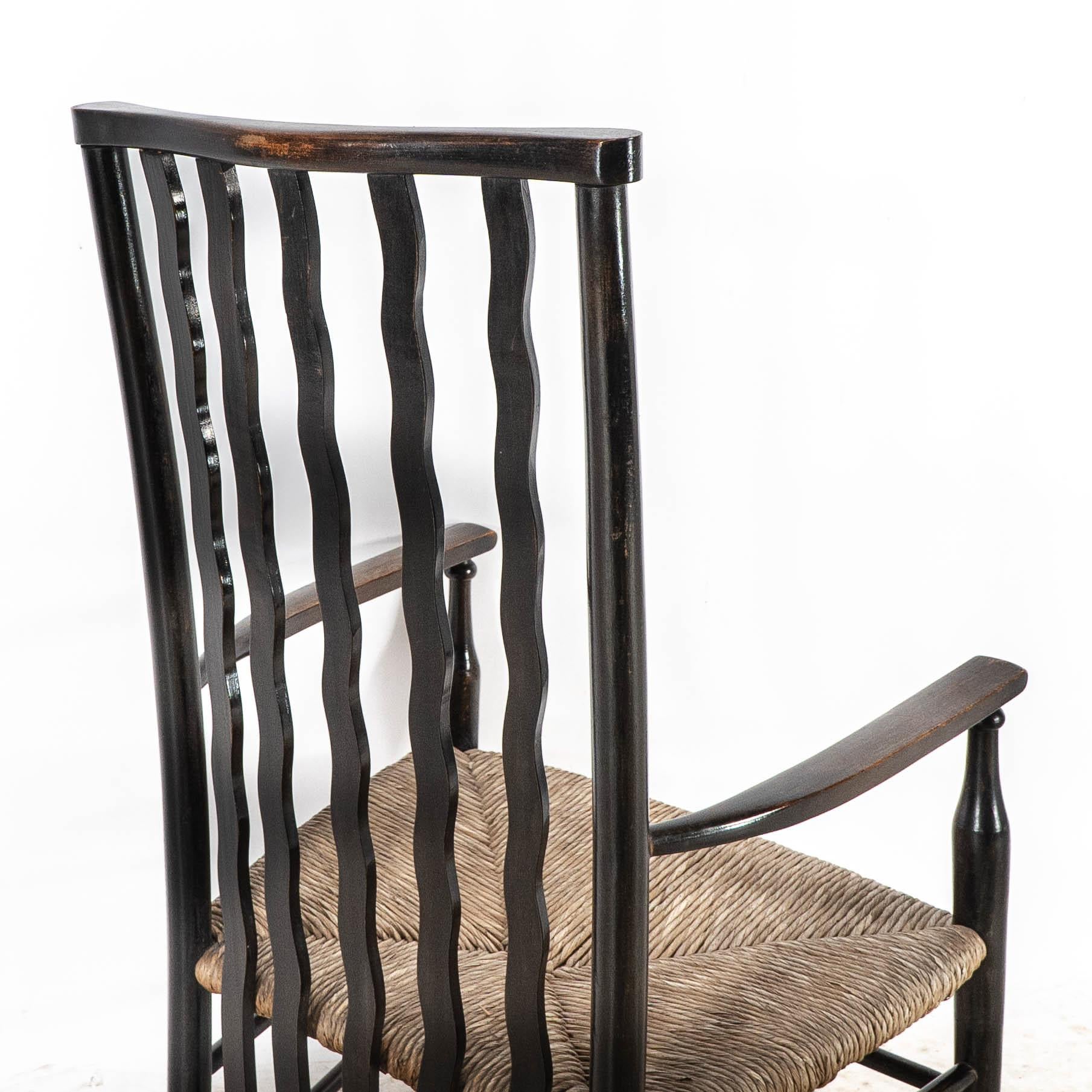 Liberty & Co. An Arts & Crafts rush seat armchair with wavy shaped back slats For Sale 9