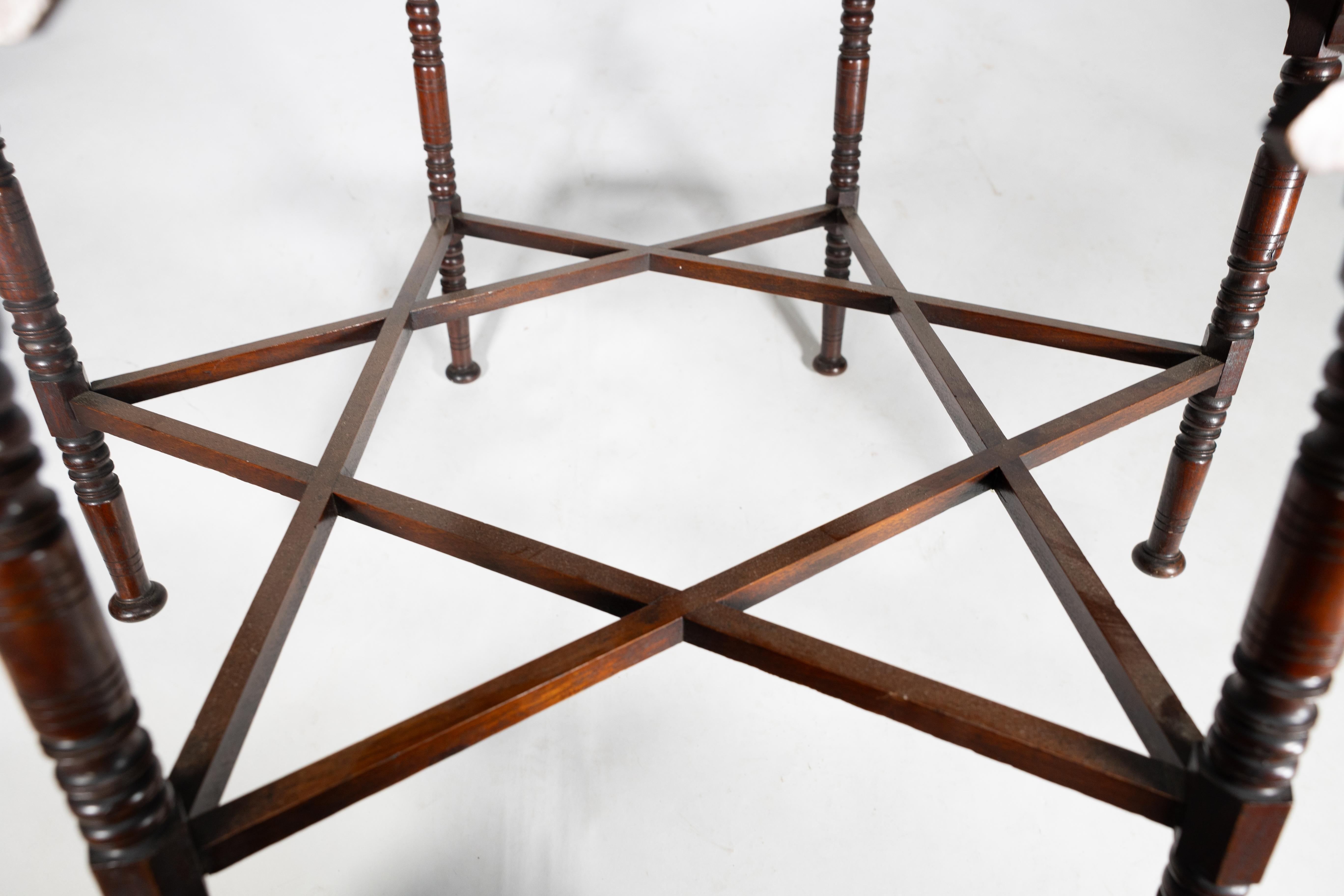 Liberty & Co. An Arts & Crafts walnut centre table with arched aprons 6