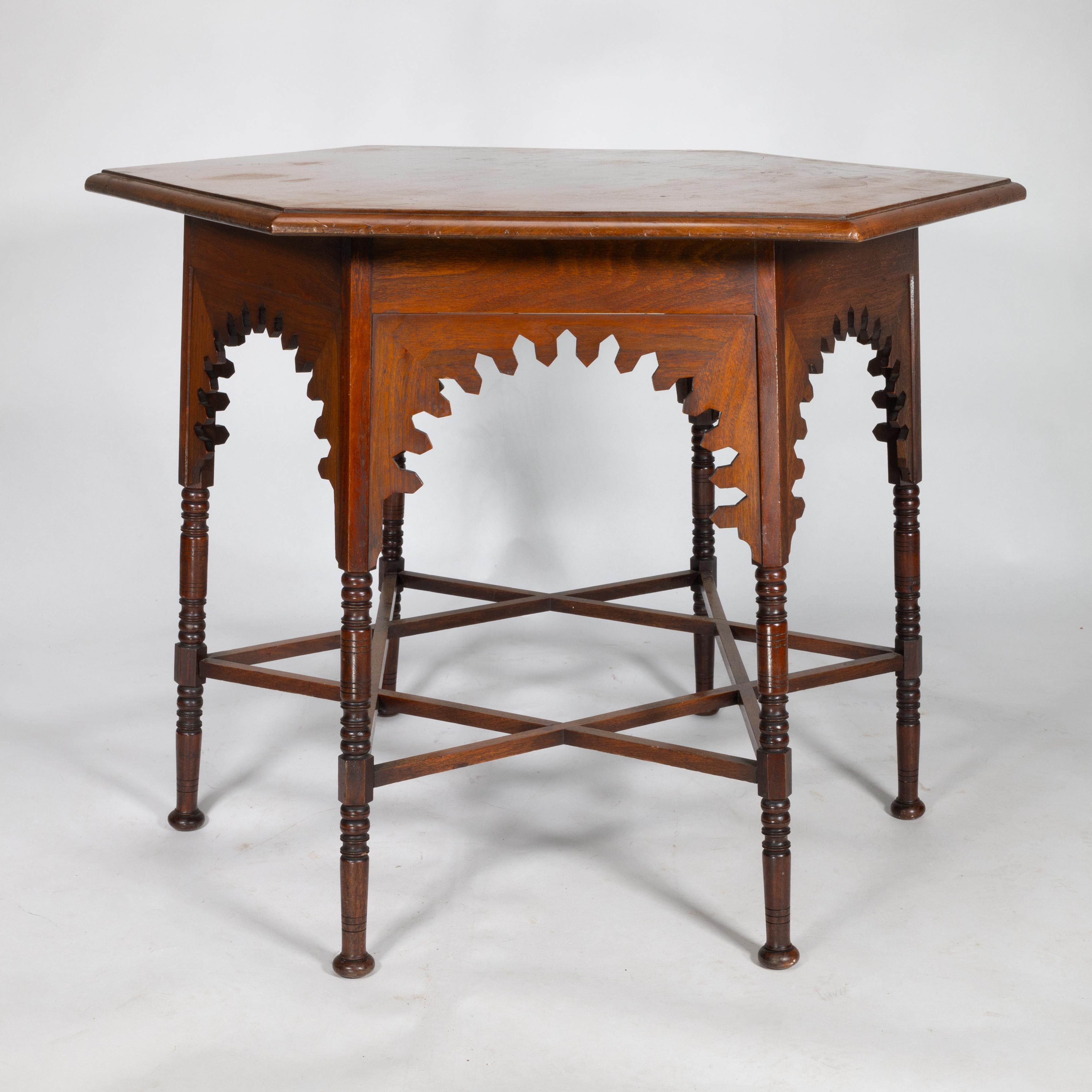 Liberty & Co. An Arts & Crafts walnut centre table with arched aprons In Good Condition In London, GB
