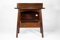 Liberty & Co. An Arts & Crafts walnut side cabinet in the style of Morris & Co.