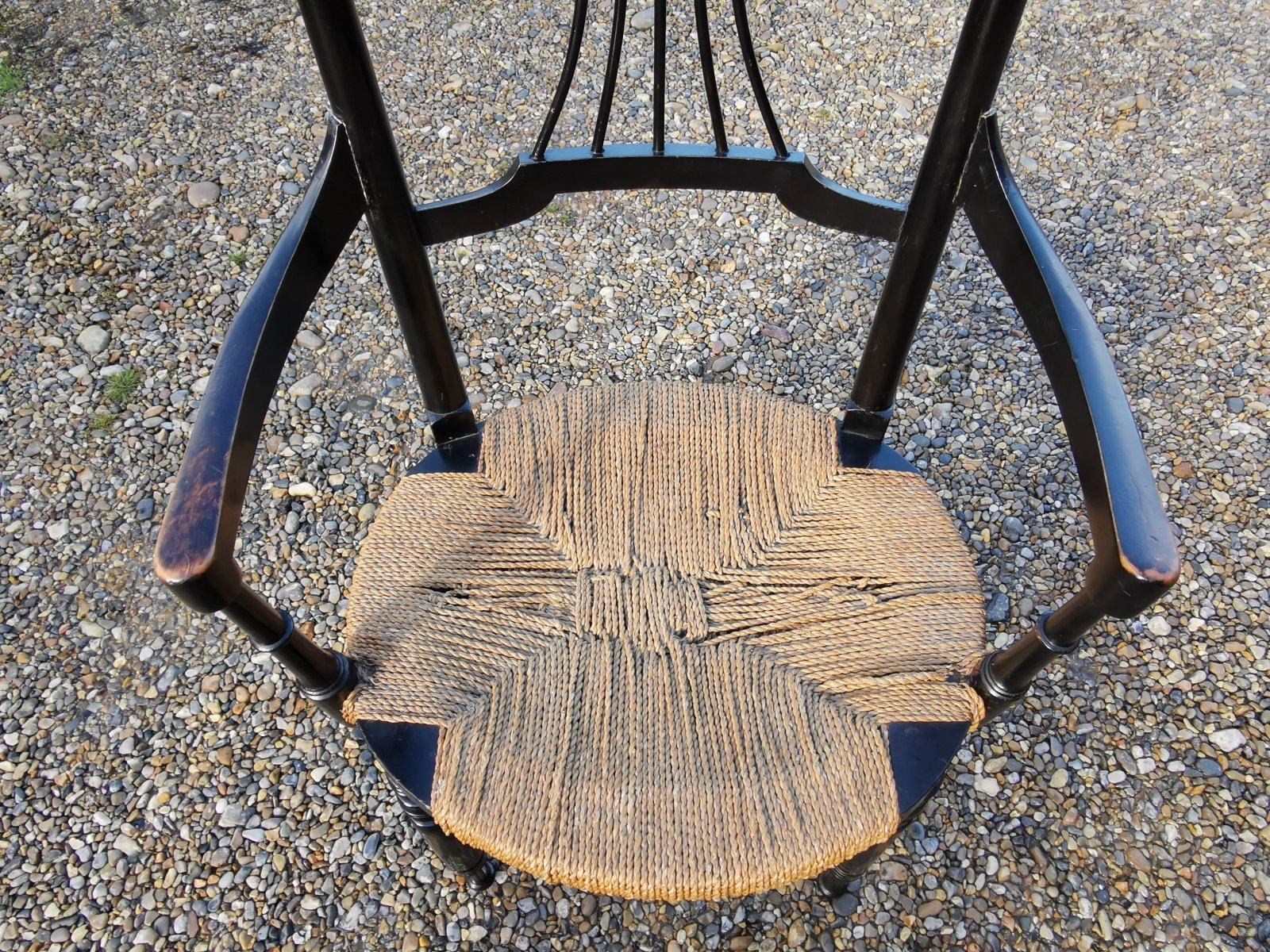 Hêtre Fauteuil Liberty & Co., mouvement esthétique anglais, en bois d'ébène avec assise en forme de mer en vente