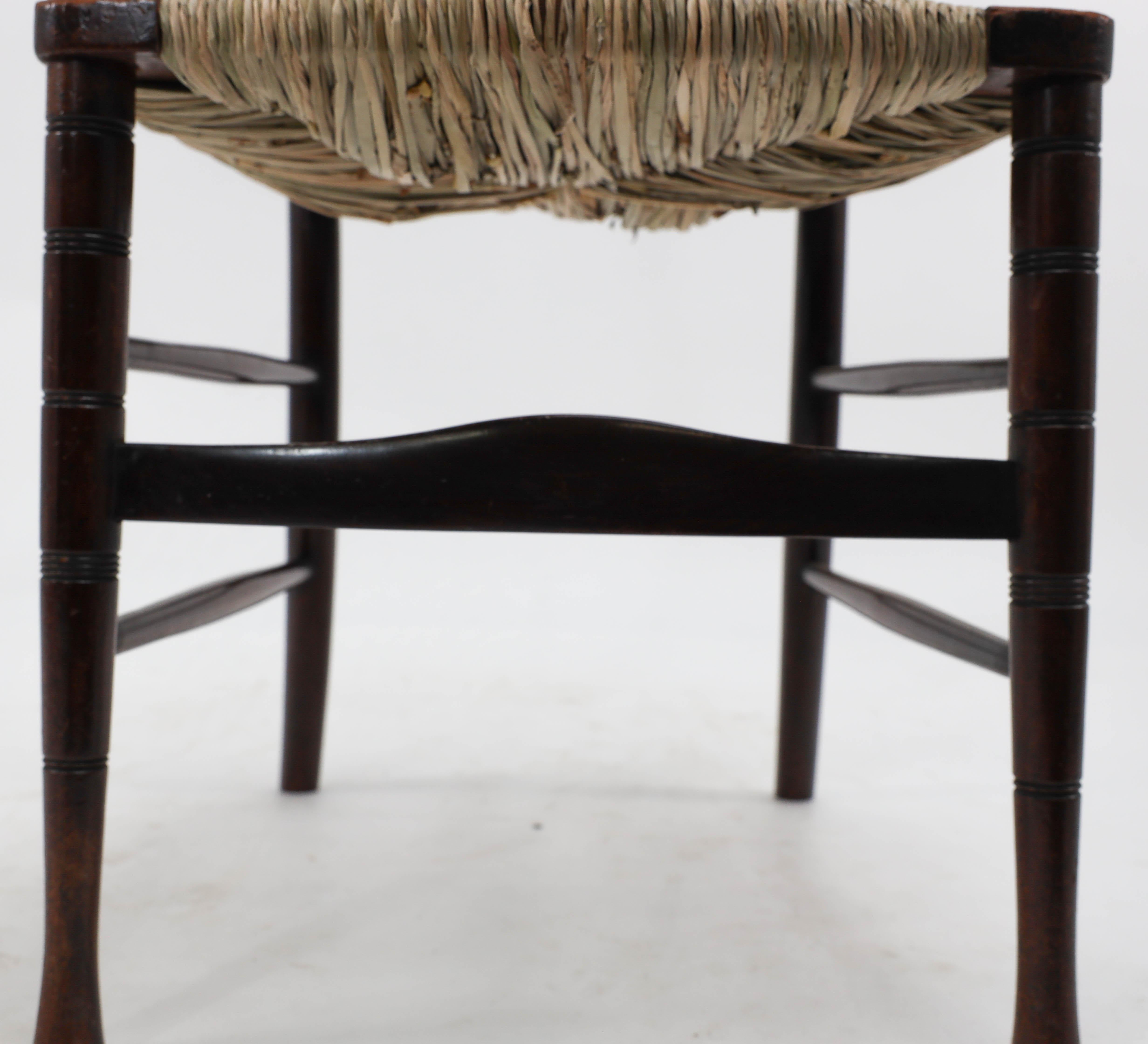 Rush Liberty & Co. An English Aesthetic Movement walnut ladder back rush seat chair For Sale