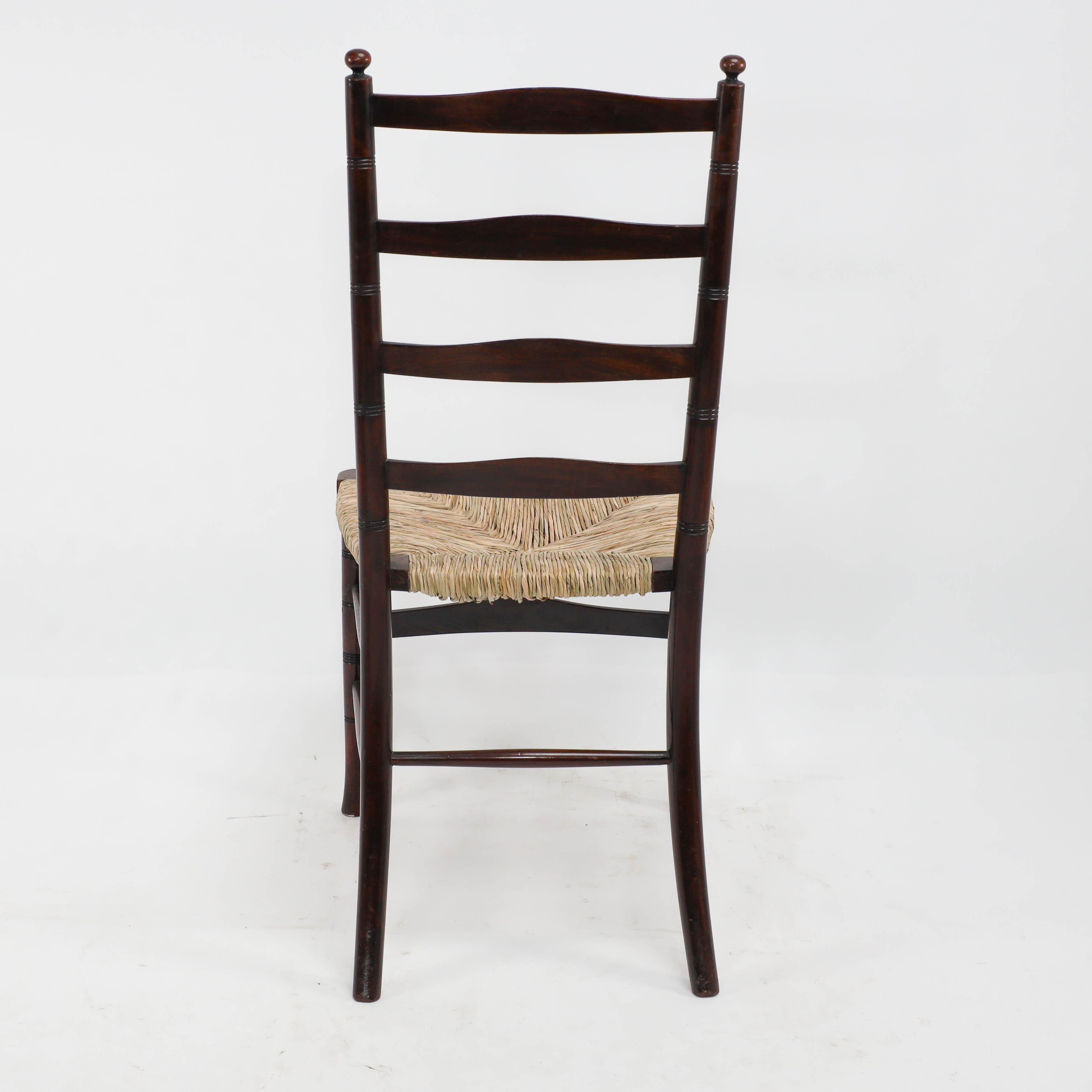Liberty & Co. An English Aesthetic Movement walnut ladder back rush seat chair For Sale 4