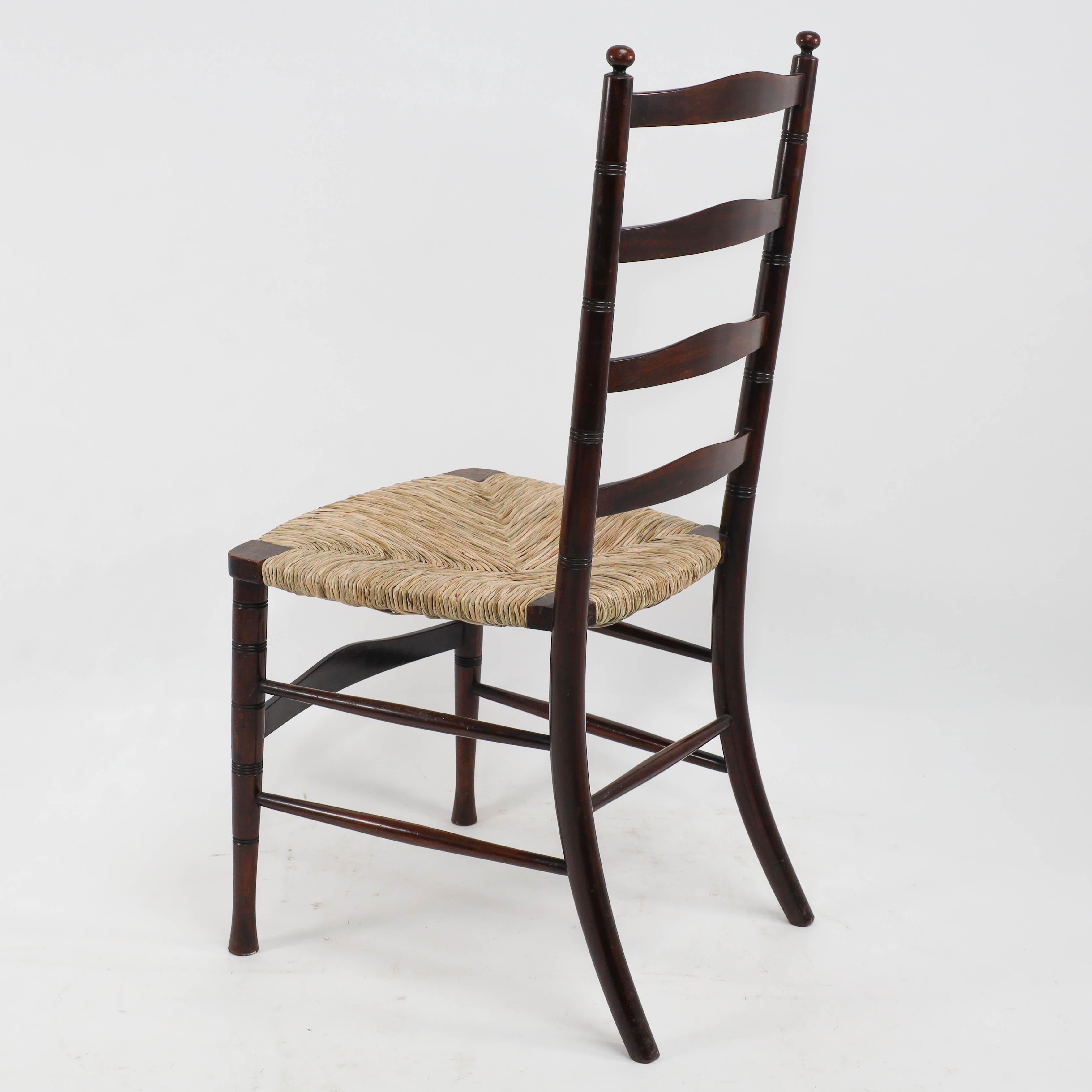 Liberty & Co. An English Aesthetic Movement walnut ladder back rush seat chair For Sale 5