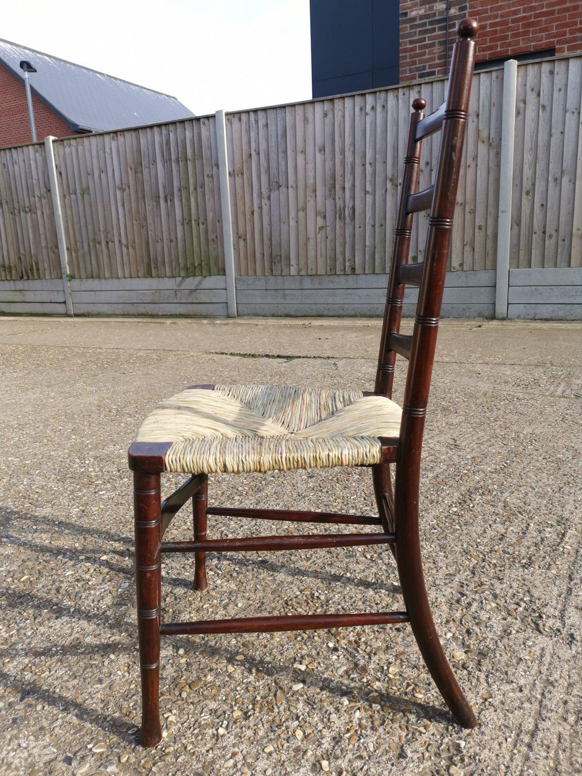 Hand-Crafted Liberty & Co. An English Aesthetic Movement Walnut Ladder Back Rush Seat Chair For Sale