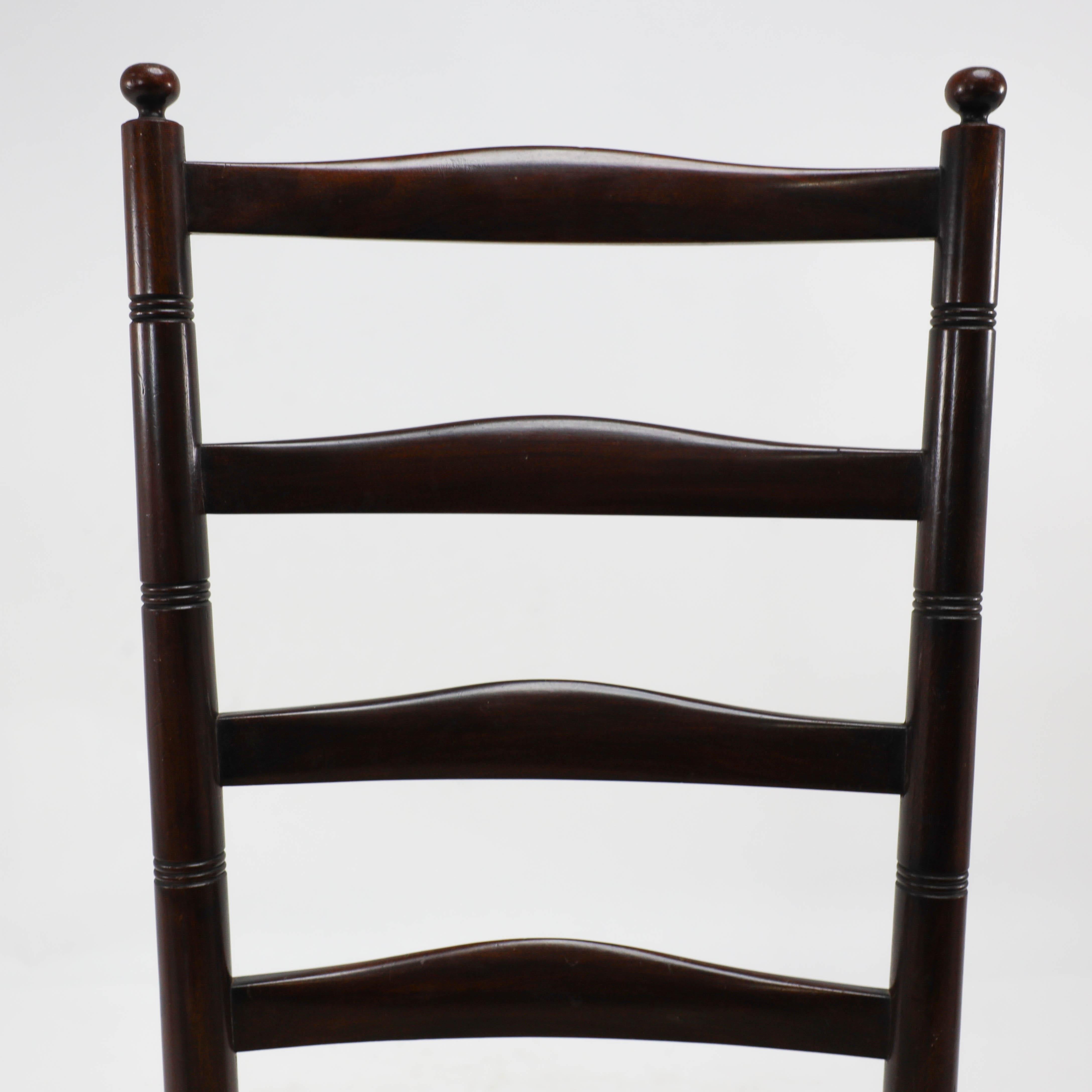 Arts and Crafts Liberty & Co. An English Aesthetic Movement walnut ladder back rush seat chair For Sale