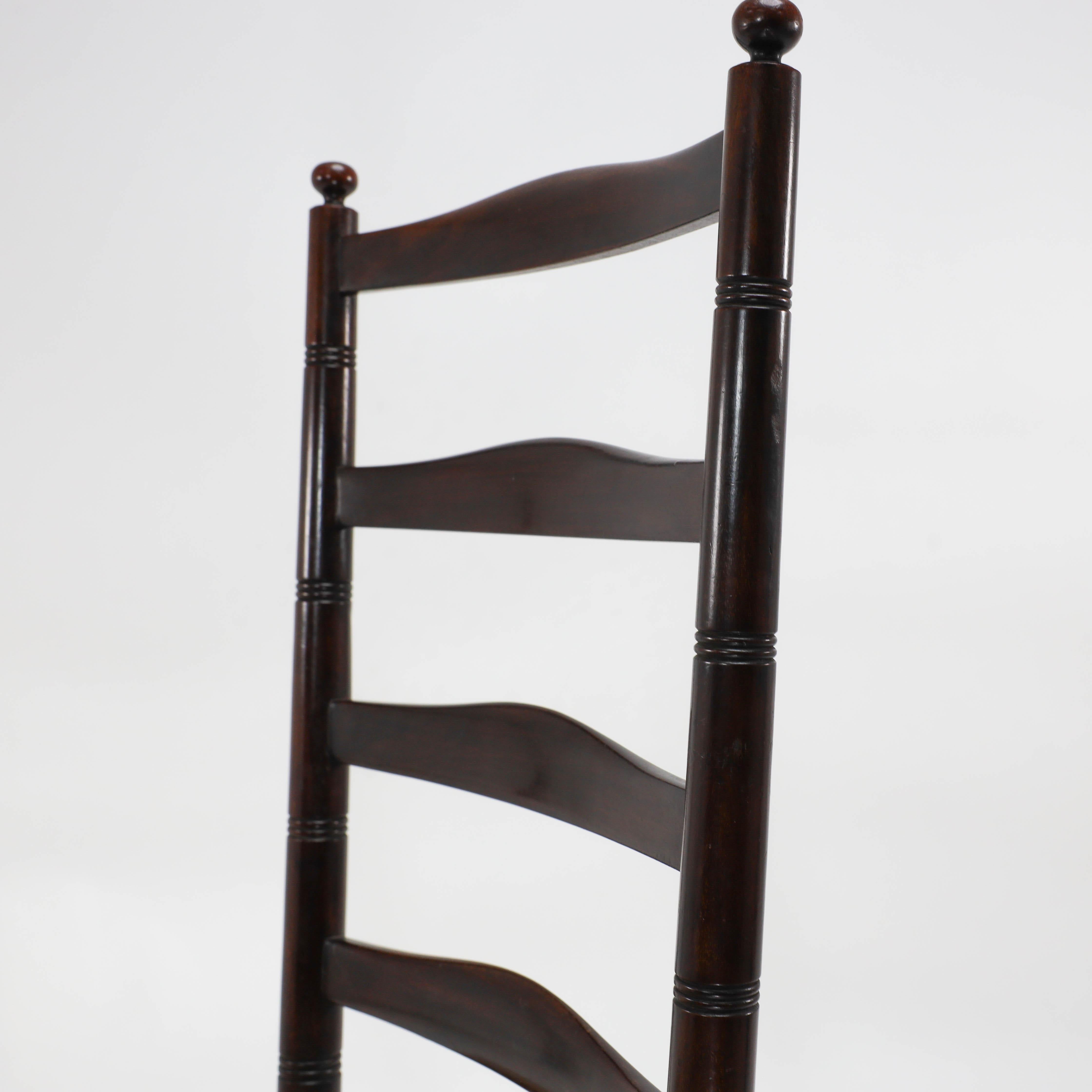 Hand-Crafted Liberty & Co. An English Aesthetic Movement walnut ladder back rush seat chair For Sale