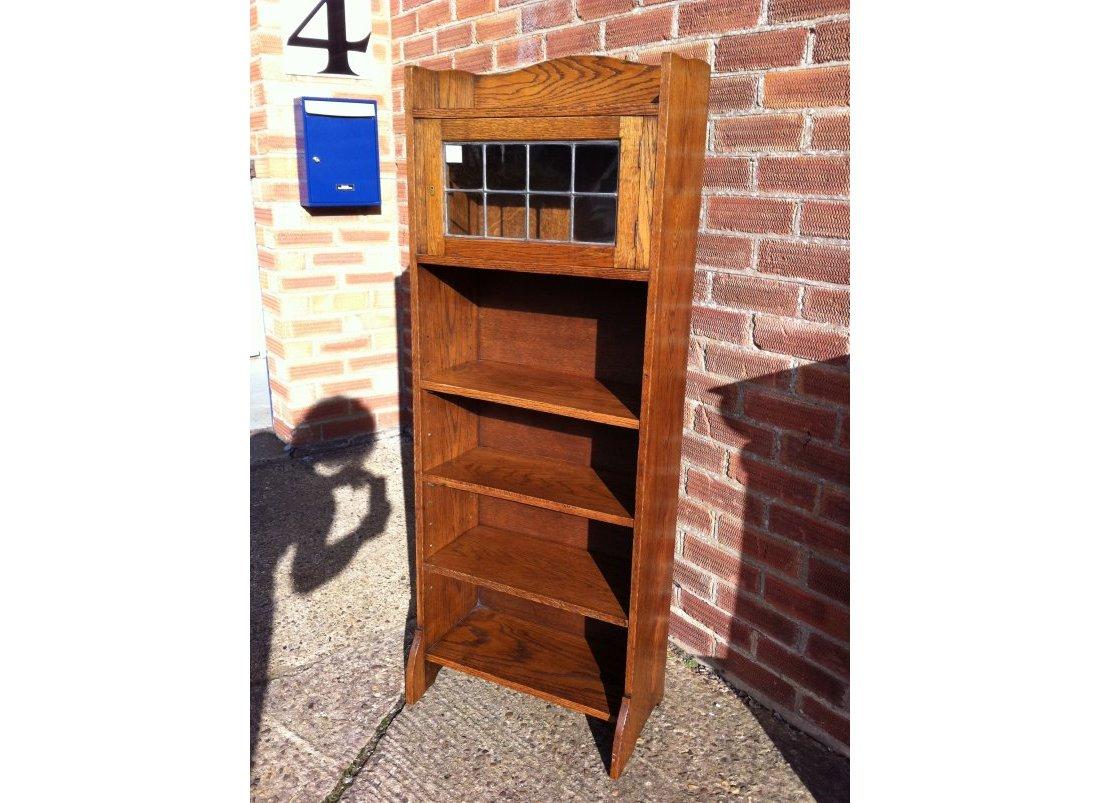 Arts and Crafts Liberty & Co. an English Arts & Crafts Oak Bookcase, with Shaped Upper Details For Sale