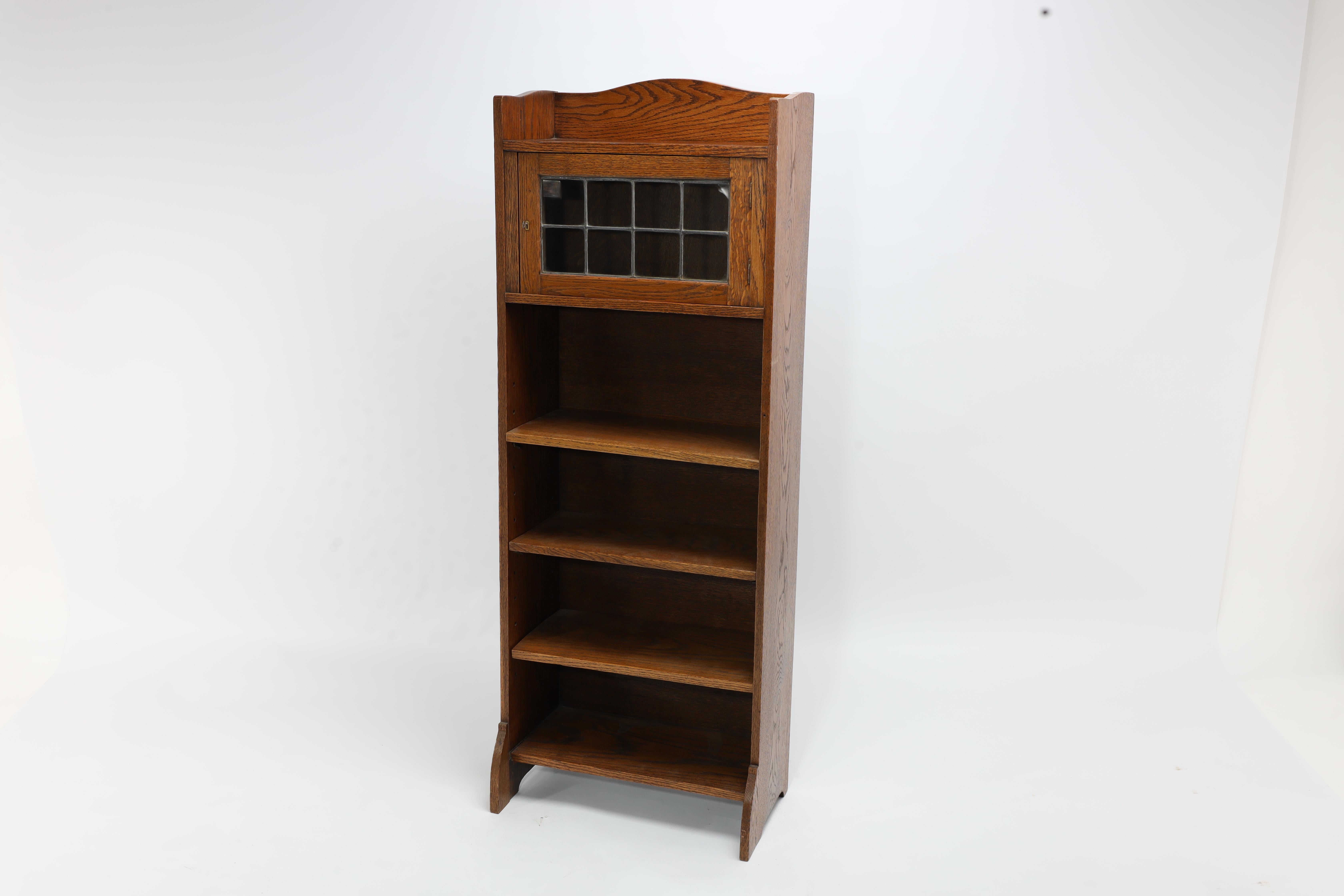 Hand-Crafted Liberty & Co. an English Arts & Crafts Oak Bookcase, with Shaped Upper Details For Sale