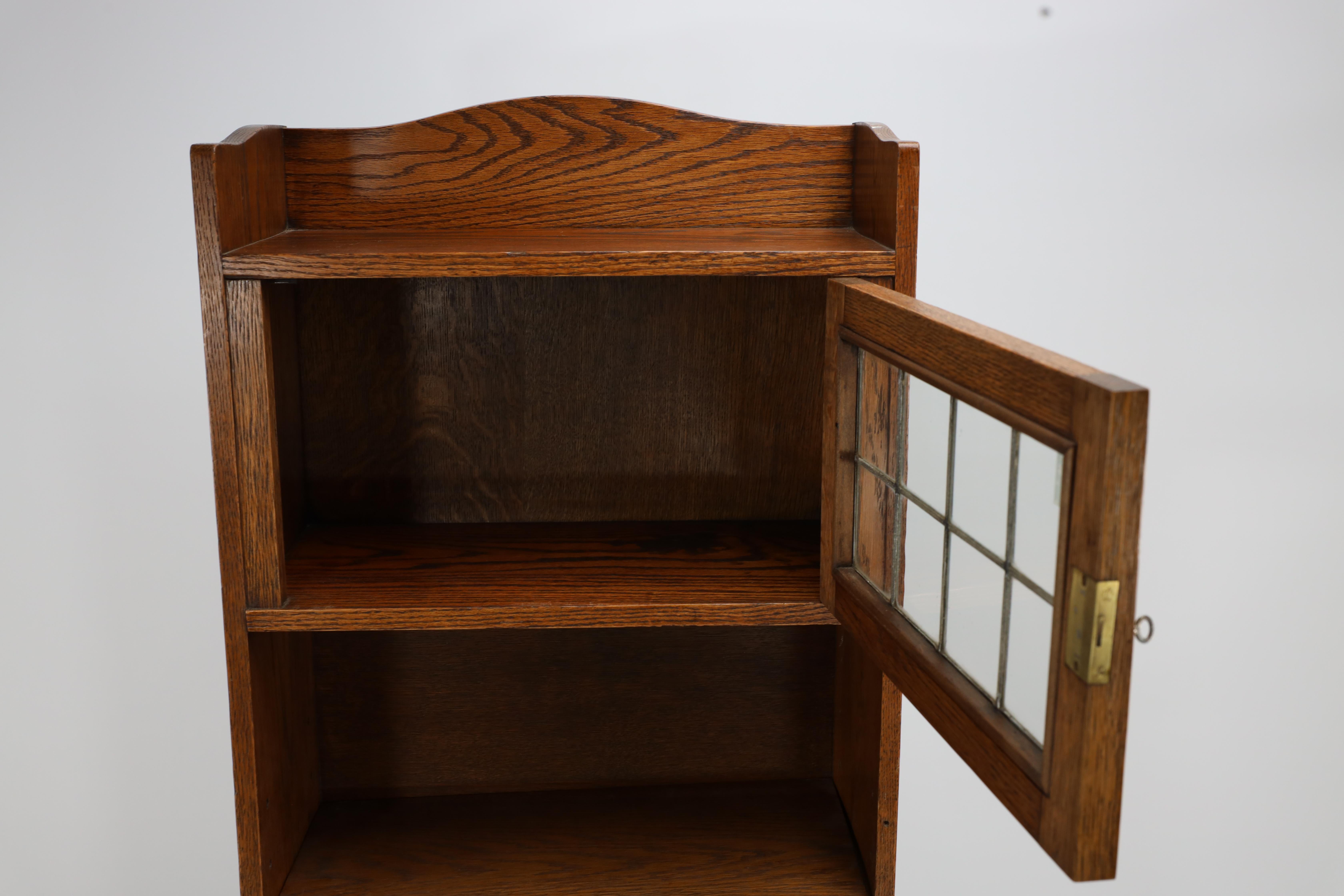 Liberty & Co. an English Arts & Crafts Oak Bookcase, with Shaped Upper Details For Sale 3