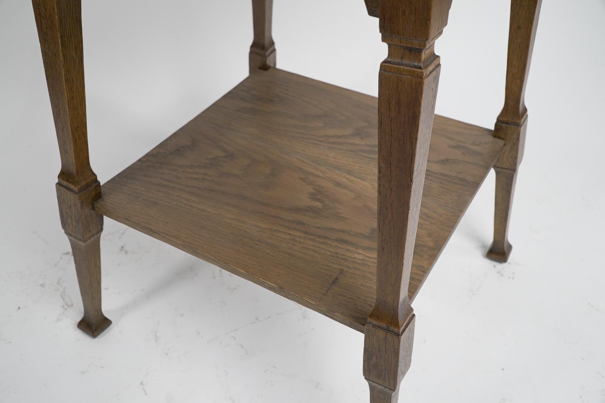 Liberty & Co. An Arts & Crafts oak two tier side table with Moorish aprons. For Sale 4