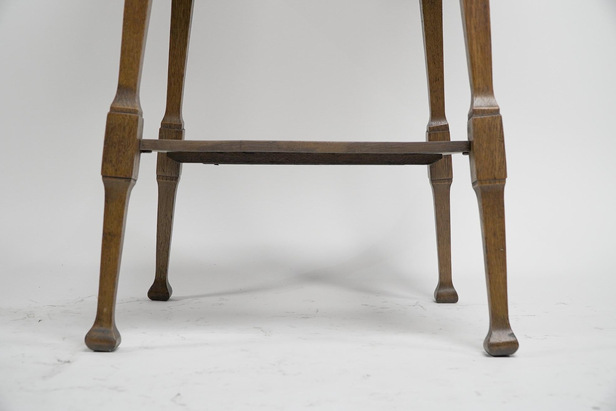 Liberty & Co. An Arts & Crafts oak two tier side table with Moorish aprons. For Sale 7
