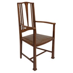 Liberty 
Co. Arts 
Crafts armchair inlaid with hearts 
subtle floral inlays.