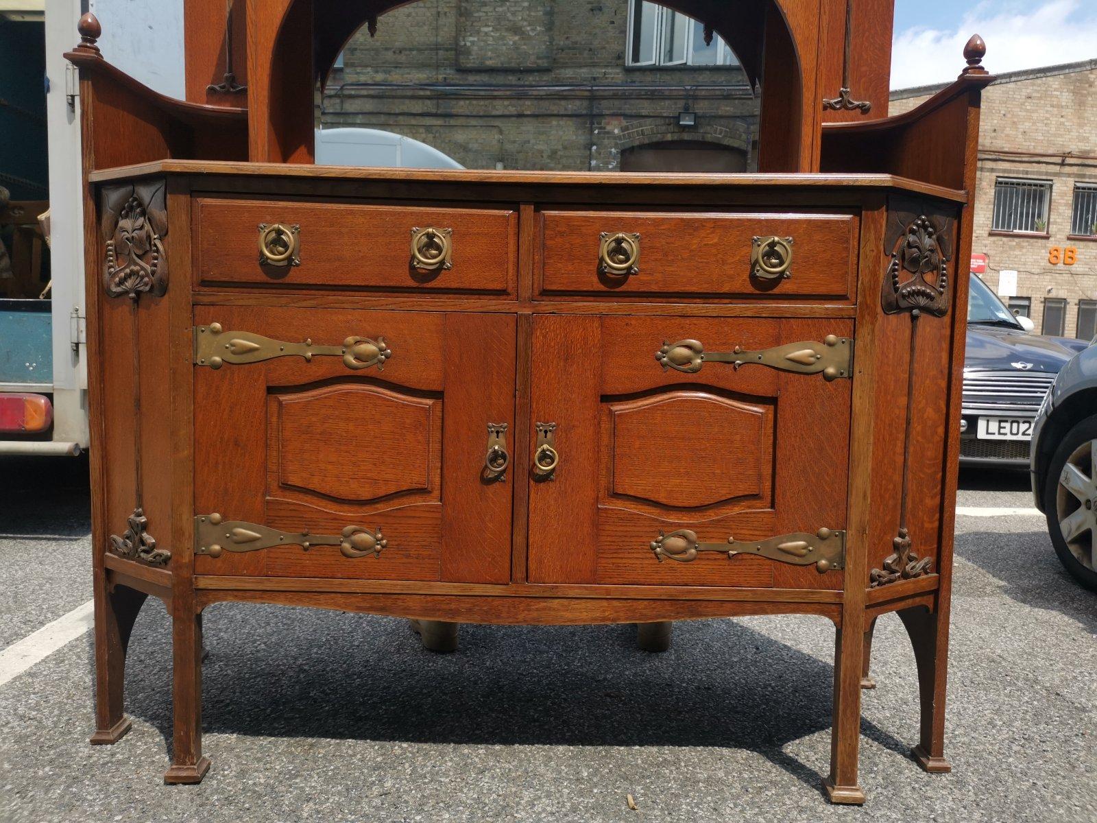 Liberty & Co Attr. An English Arts & Crafts Oak Sideboard with Carved Decoration For Sale 3