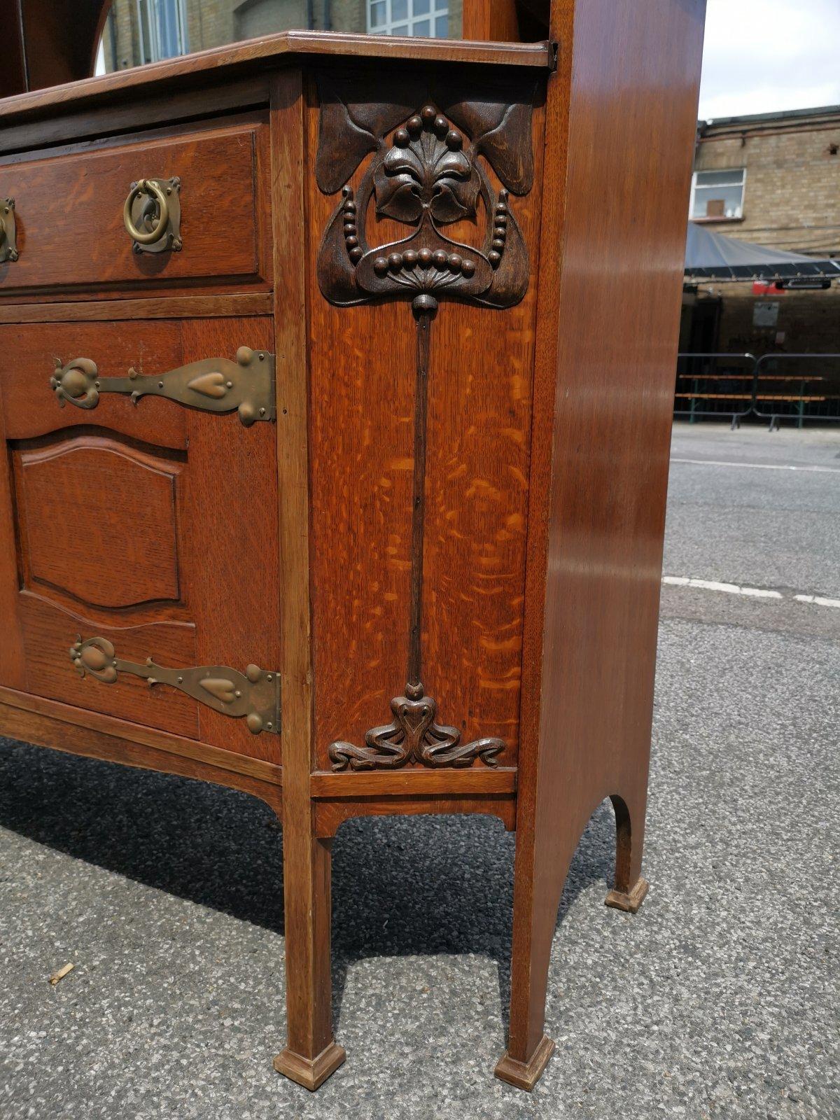 Liberty & Co Attr. An English Arts & Crafts Oak Sideboard with Carved Decoration For Sale 3