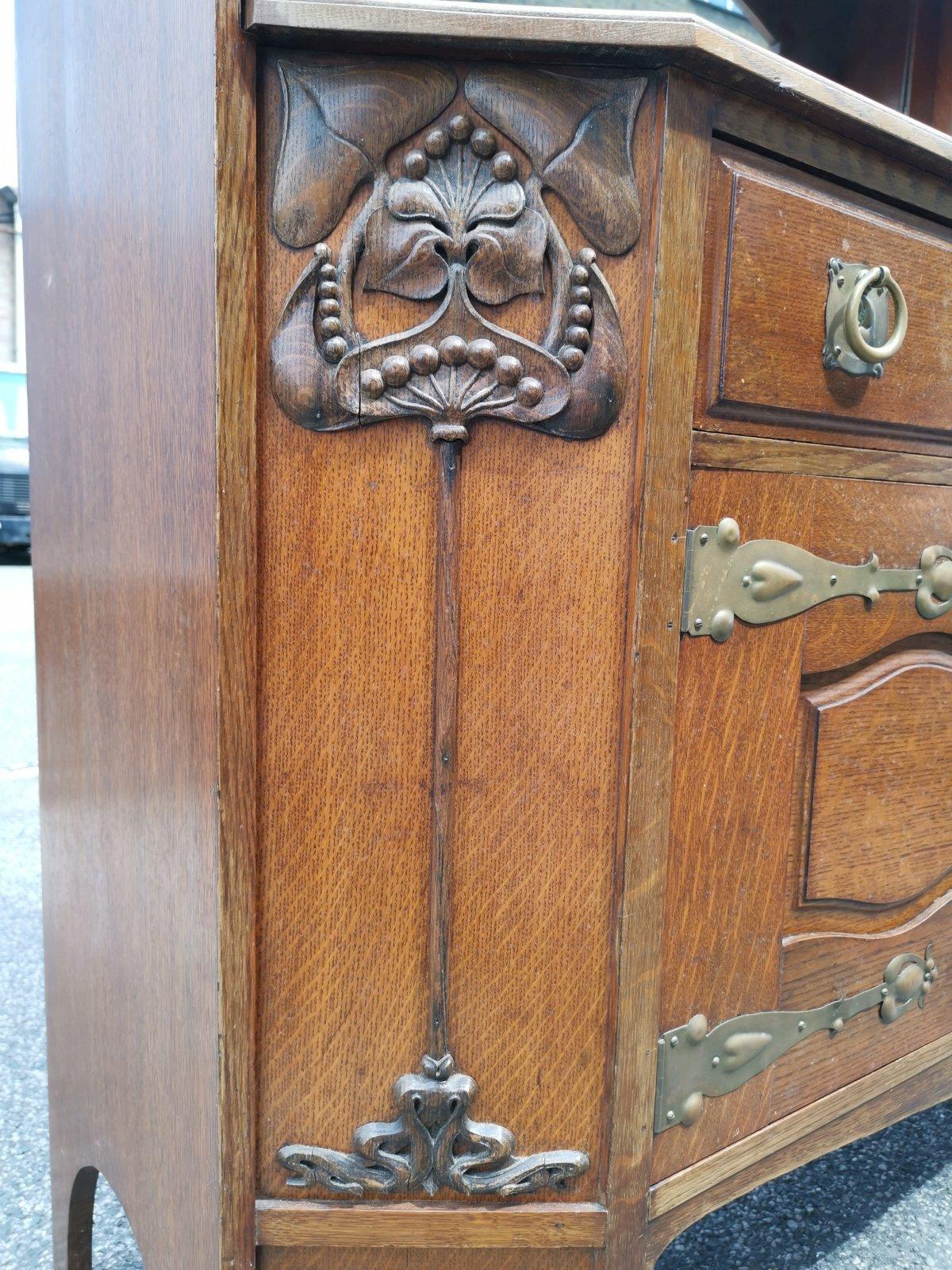 Liberty & Co Attr. An English Arts & Crafts Oak Sideboard with Carved Decoration For Sale 7