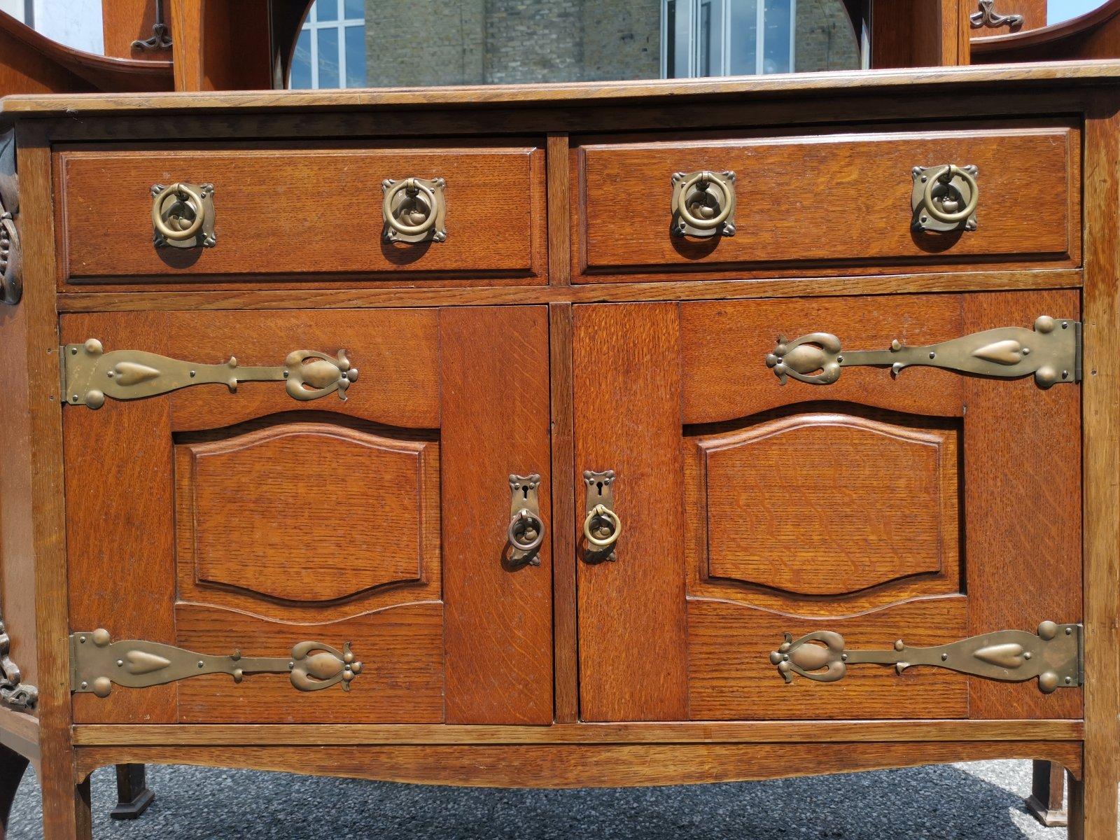 Liberty & Co Attr. An English Arts & Crafts Oak Sideboard with Carved Decoration For Sale 9