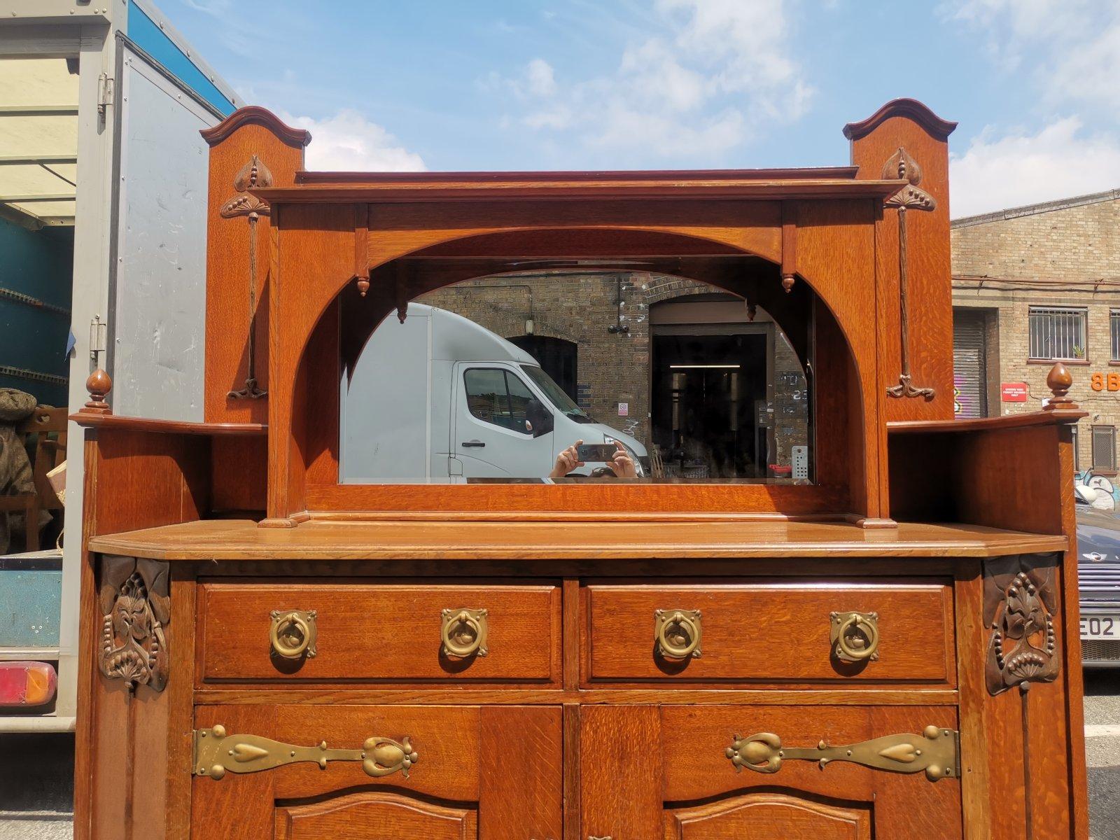 Liberty & Co Attr. An English Arts & Crafts Oak Sideboard with Carved Decoration In Good Condition For Sale In London, GB