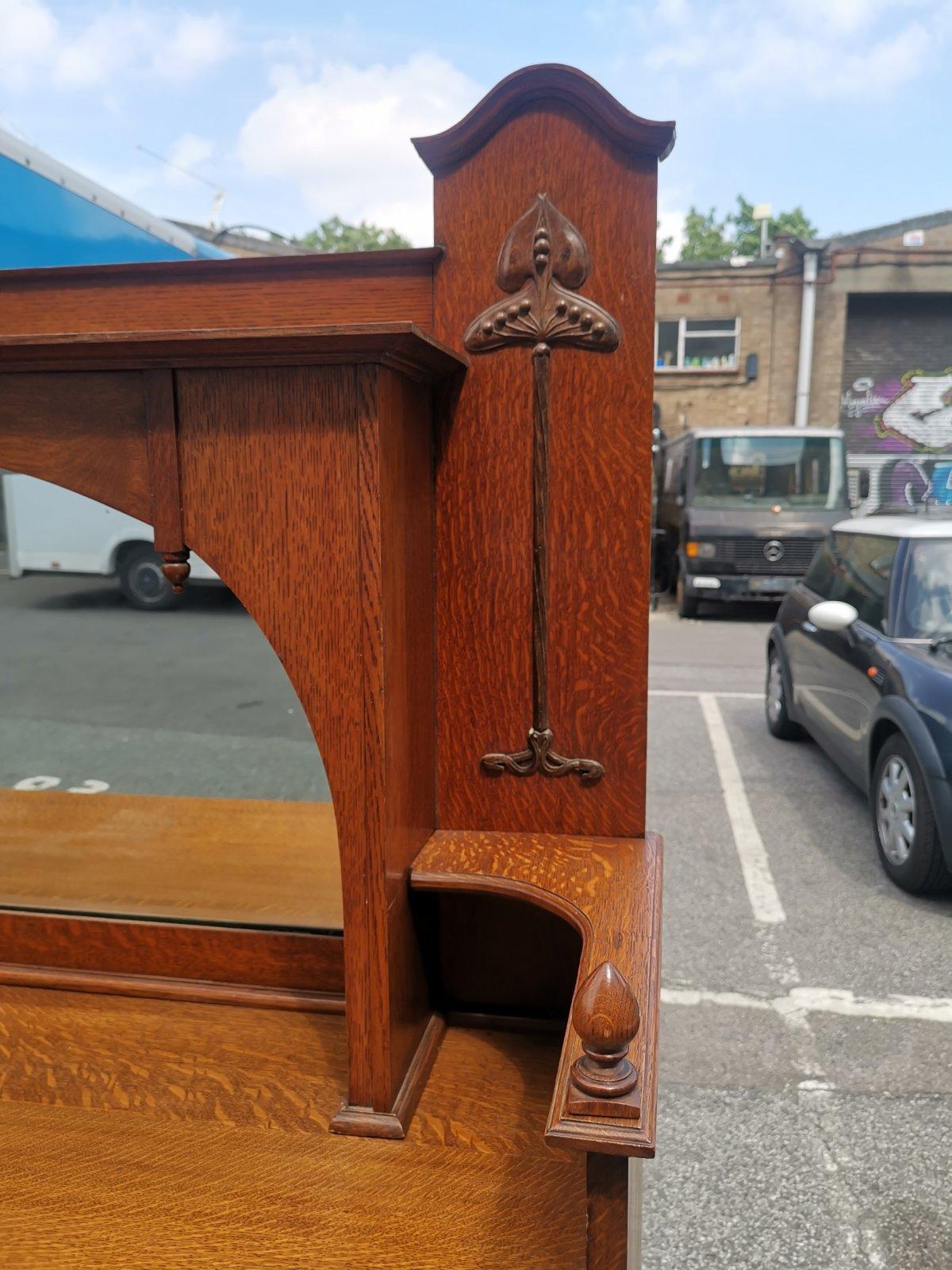 Liberty & Co Attr. An English Arts & Crafts Oak Sideboard with Carved Decoration For Sale 1