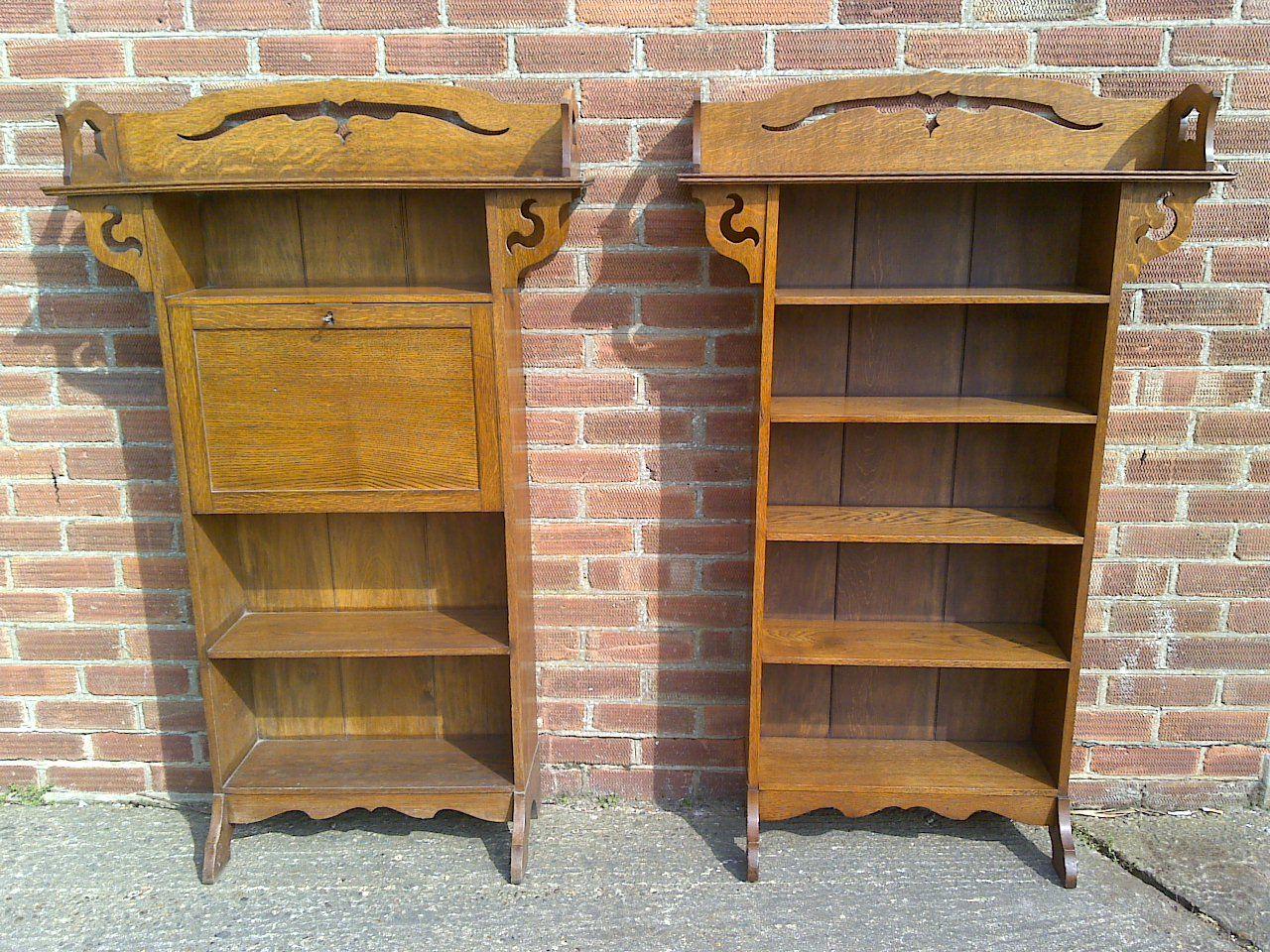 A good quality Liberty and Co Arts and Crafts golden oak bookcase and matching Bureau bookcase with stylised floral cut-outs to the tops and shaped bottom skirts.
Height 48, Width 21 1/2, Depth at feet 9 1/2