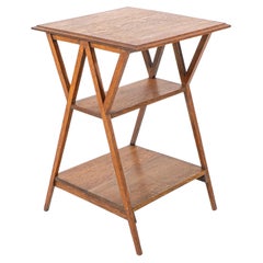 Liberty & Co attr. Arts & Crafts oak three tier side table with angle supports