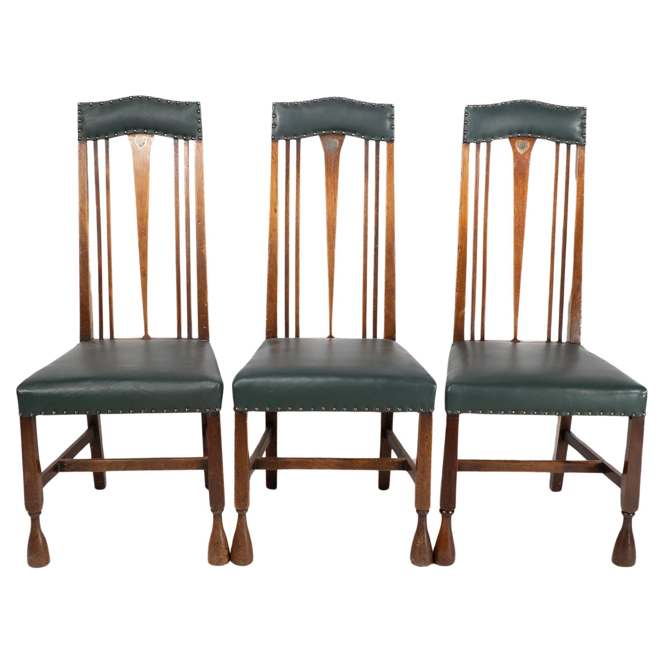 Liberty & Co. attr. Set of 3 dining chairs with Voysey style inlaid pewter heart