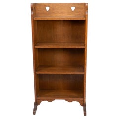 Liberty & Co. attri. An Arts & Crafts oak bookcase with stylized heart cut-outs