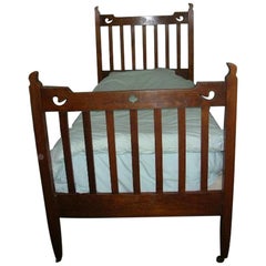 Vintage Liberty & Co. Attributed, an Arts & Crafts Oak Bed with Stylized Floral Cut-Outs