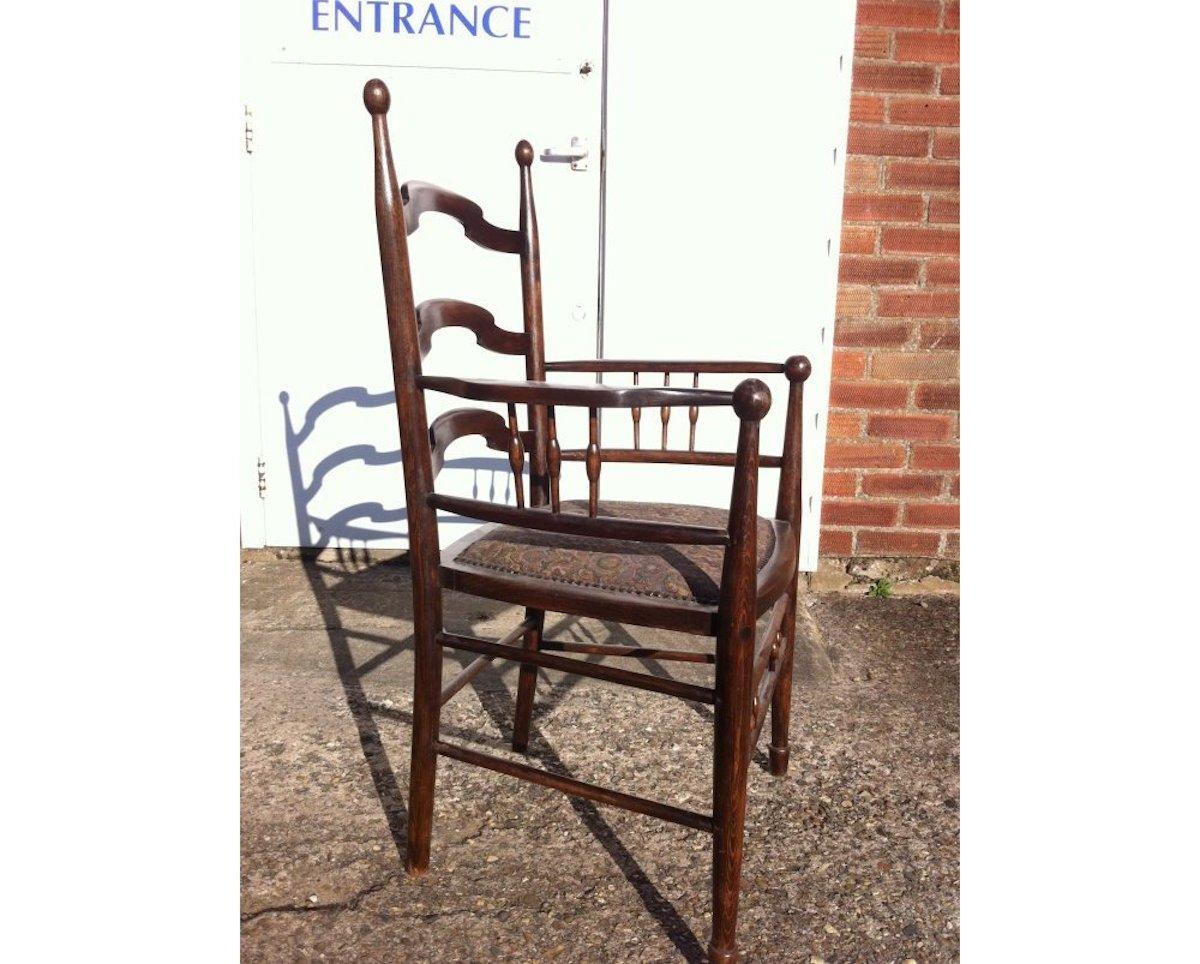 Arts and Crafts Liberty & Co Attributed, an English Walnut Arts & Crafts Ladder Back Armchair For Sale