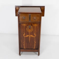 Liberty & Co attributed. Arts & Crafts coal purdonium with inlaid floral details