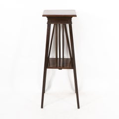 Liberty & Co in the style of E W Godwin. An Anglo-Japanese two tier plant stand