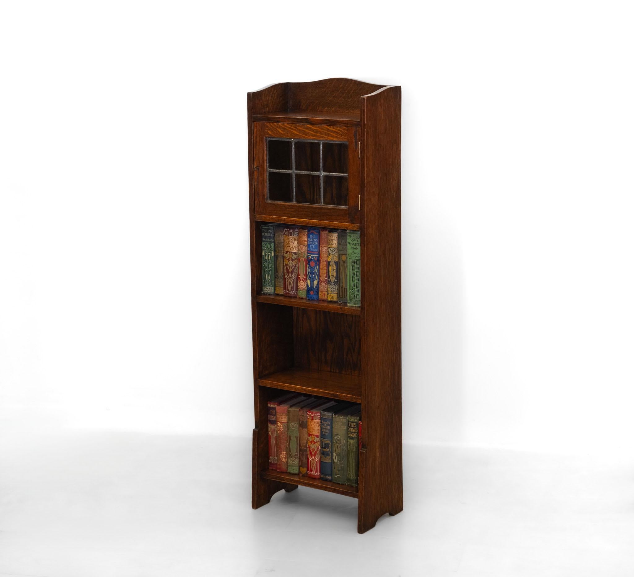 Liberty & Co Narrow Oak Open Bookcase With Leaded Glazed Cupboard Circa 1900 en venta 5
