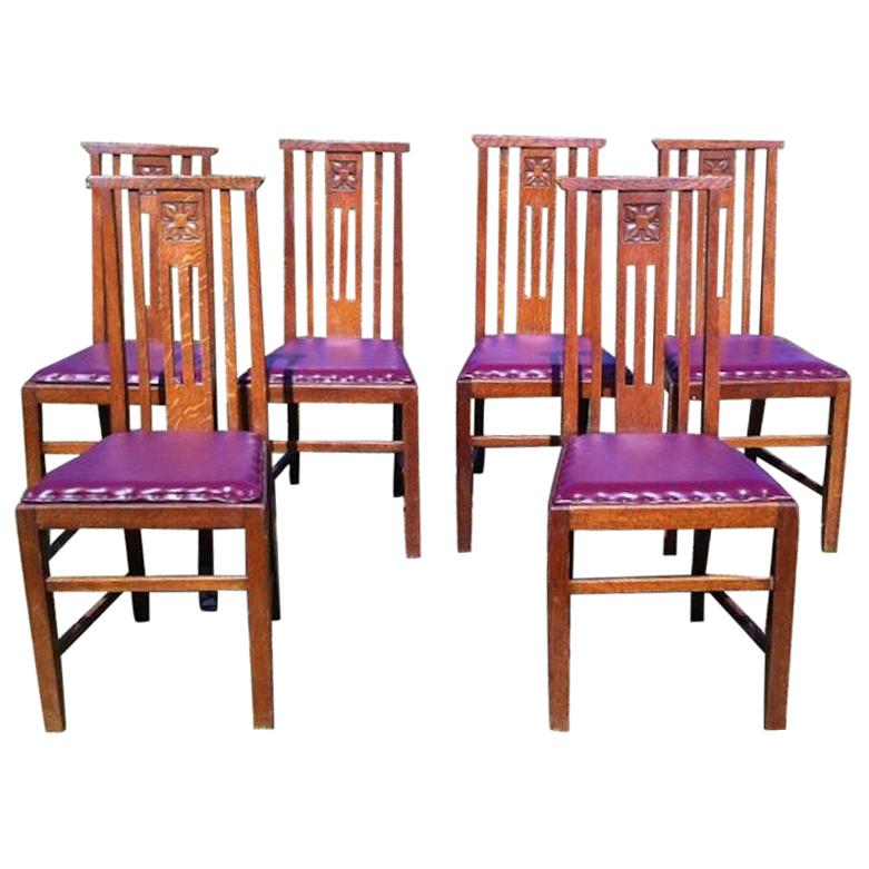 Liberty & Co Six Arts & Crafts Oak Dining Chairs with Stylized Floral Carving