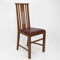 Liberty & Co Six Arts & Crafts Oak Dining Chairs with Stylized Floral Carving