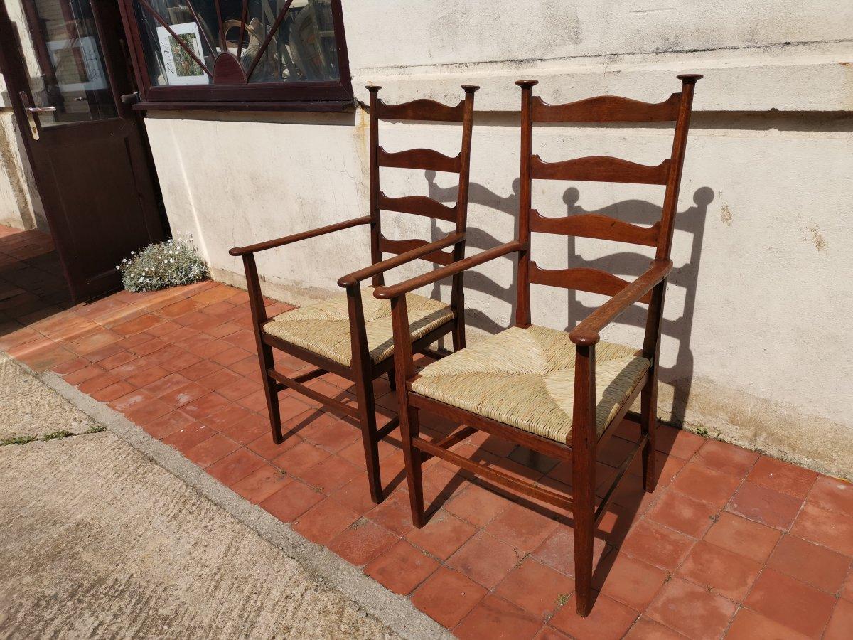 Arts and Crafts Liberty & Co. Style of CFA Voysey. A Pair of Oak Rush Seat Ladderback Armchairs For Sale