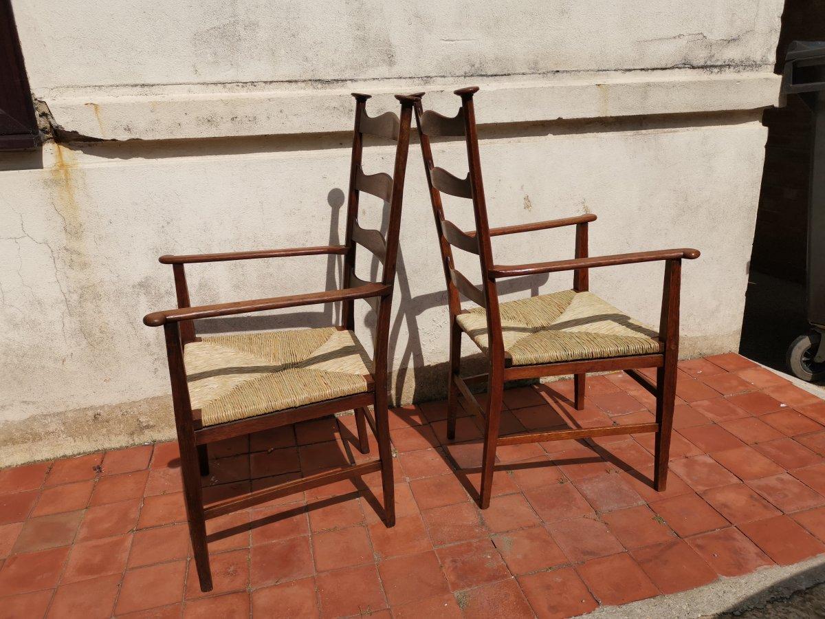 Arts and Crafts Liberty & Co. Style of CFA Voysey. A Pair of Oak Rush Seat Ladderback Armchairs For Sale