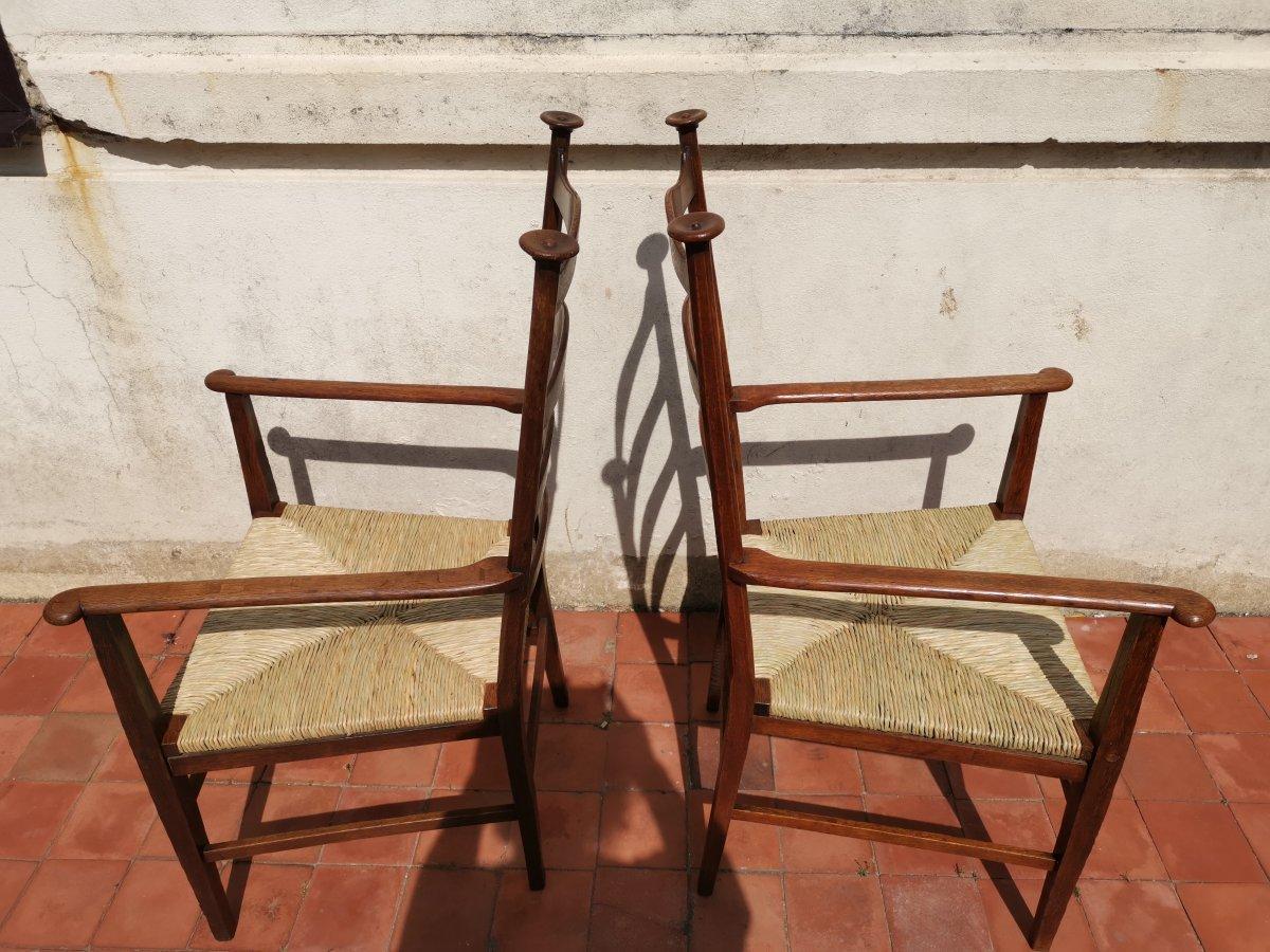 Liberty & Co. Style of CFA Voysey. A Pair of Oak Rush Seat Ladderback Armchairs In Good Condition For Sale In London, GB