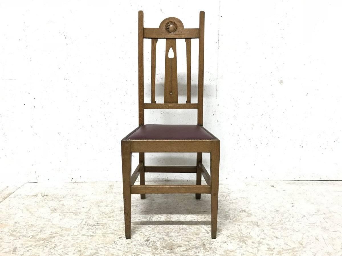 Liberty & Co, Ten Arts & Crafts Oak Dining Chairs with Stylised Floral Details In Good Condition In London, GB