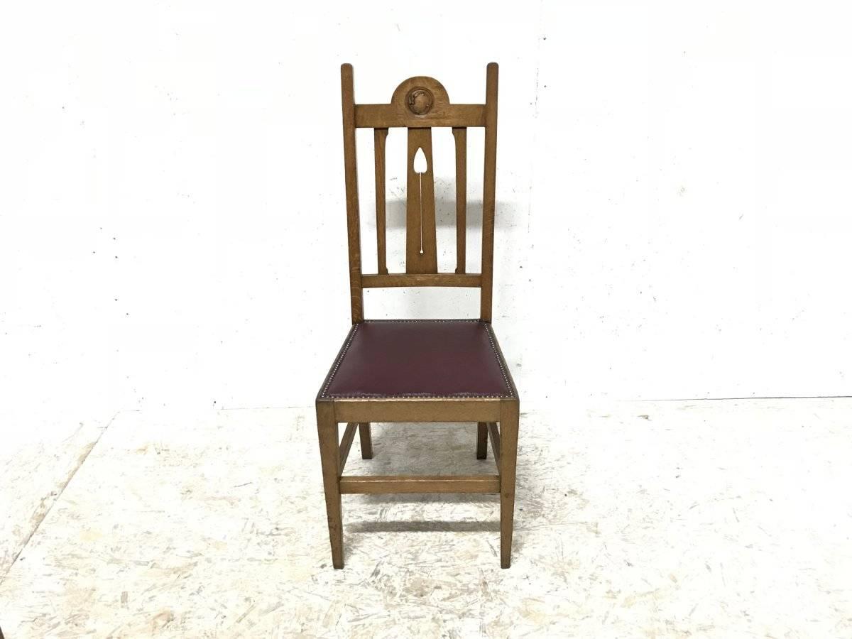 Early 20th Century Liberty & Co, Ten Arts & Crafts Oak Dining Chairs with Stylised Floral Details