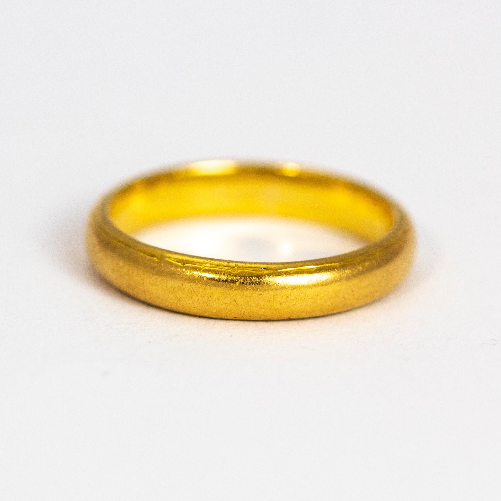Liberty & Co glossy gold band. Perfect for everyday wear or a designer wedding band. Modelled out of 22ct gold.

Ring Size: J or 4 3/4
Band Width: 3mm

