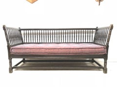 Liberty & Co. William Birch, an Arts & Crafts Dark Oak Settee with Angular Sides