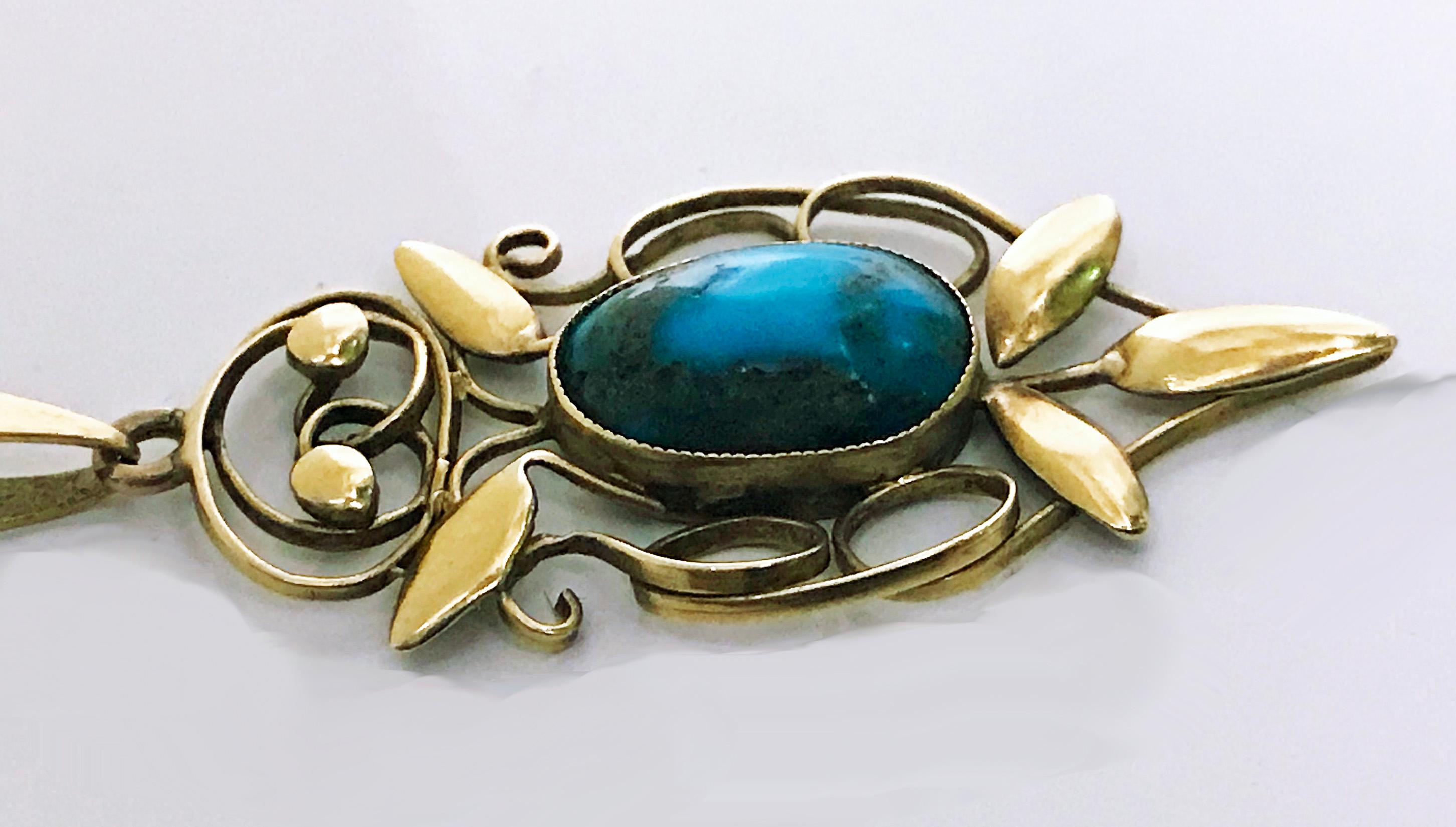 Rare Liberty Gold Turquoise Arts and Crafts Art Nouveau Pendant, William Haseler C.1910. Fully signed for W. H Haseler and 15ct for Liberty & Co; oval cabochon turquoise bezel set drop with polished foliate gold surround, together with 9ct gold