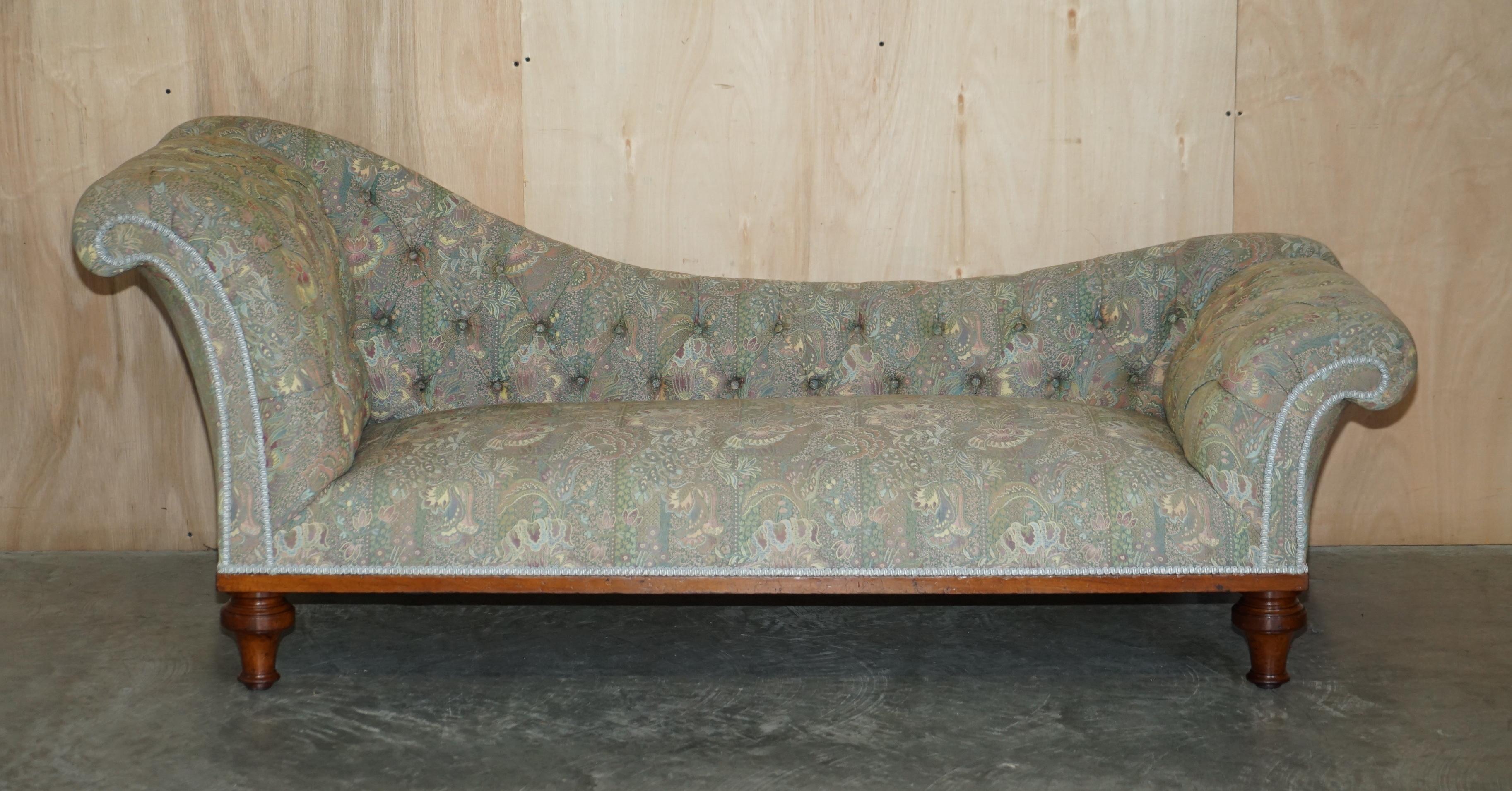We are delighted to offer for sale this exquisite circa 1880 Liberty's of London upholstered Burl Walnut framed Chesterfield tufted Chaise Lounge

This Chaise Lounge is an absolute ten, the light burl walnut frame is exquisite, the upholstery is
