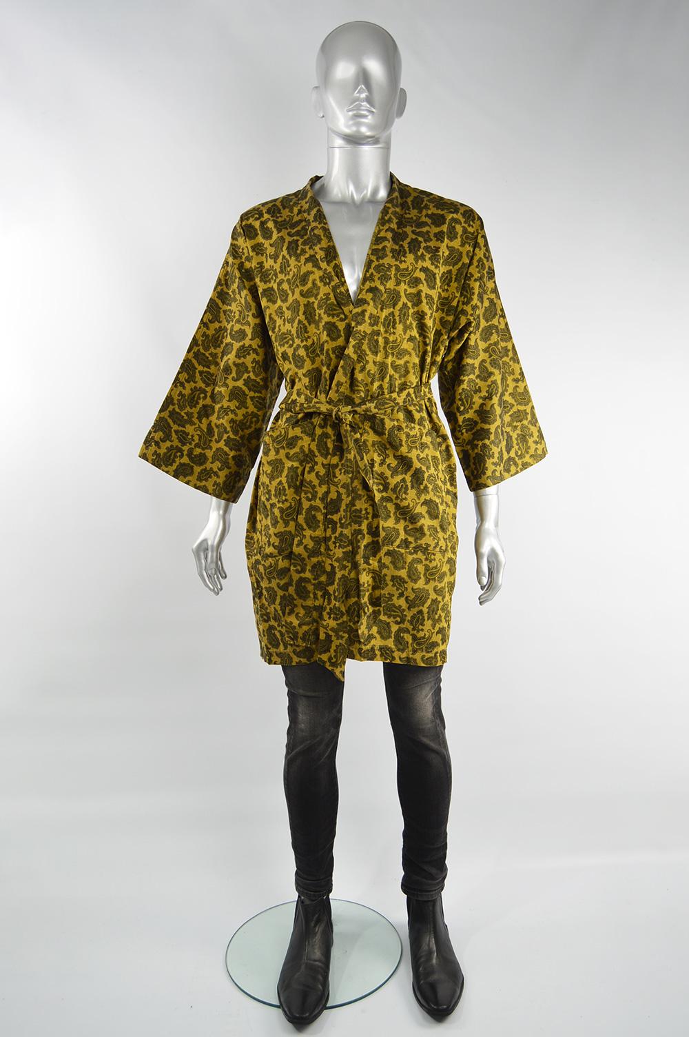An incredibly stylish vintage men's robe/ smoking jacket from the 60s by John Porter. In a gold paisley Liberty of London printed fabric with wide sleeves and a matching belt. It would look great as loungewear or worn without the belt as part of a