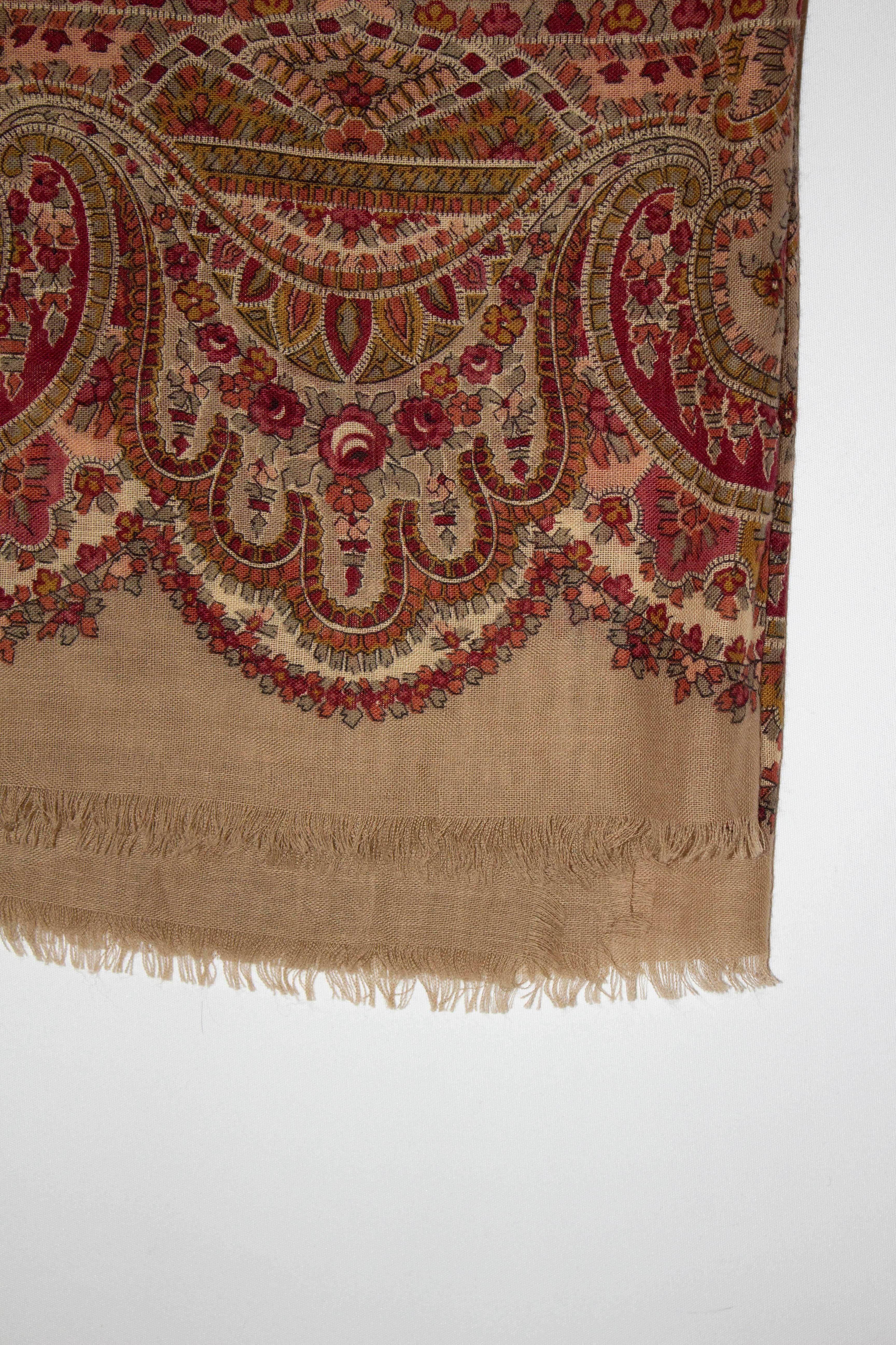 A perfect shawl /scarf for Fall, designed by Saldari for Liberty.  The scarf has a caramel background , with a pink. red and  grey floral design. 100% wool , made in Italy. 
Measurements 54'' x 54''