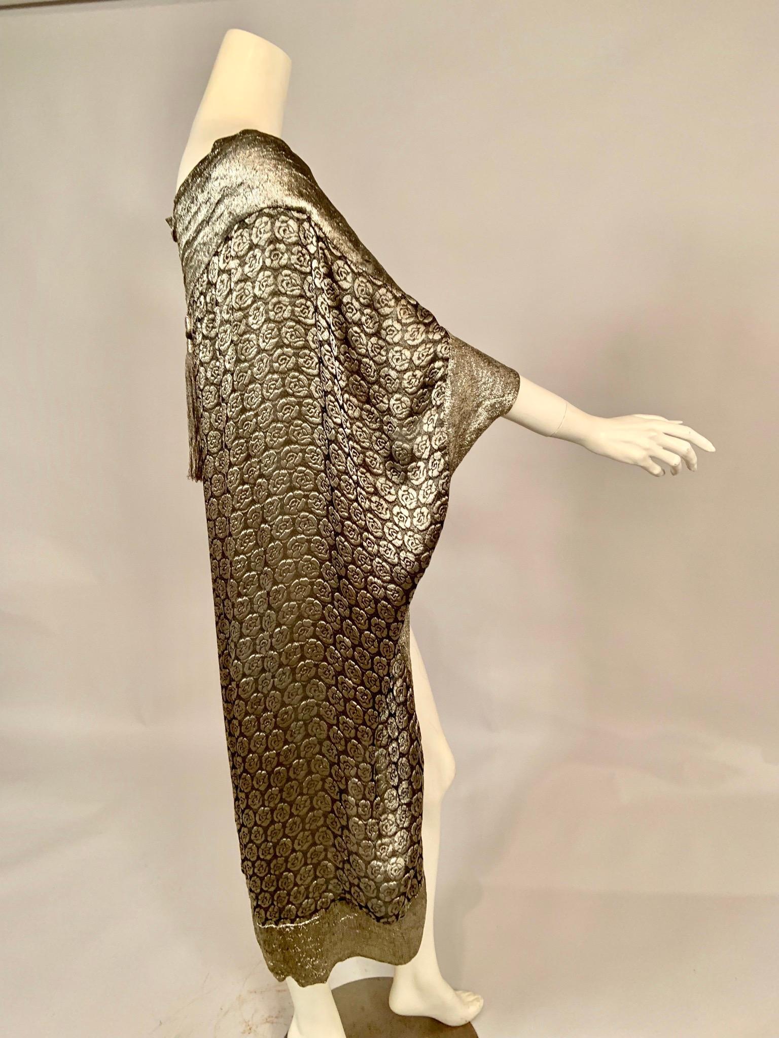 Liberty , Paris was a branch of the famous Liberty of London company, and this stunning piece was retailed by them at their Paris location. The garment can be worn as a cape, draped from the shoulder as a 1920's style cocoon with the sleeves