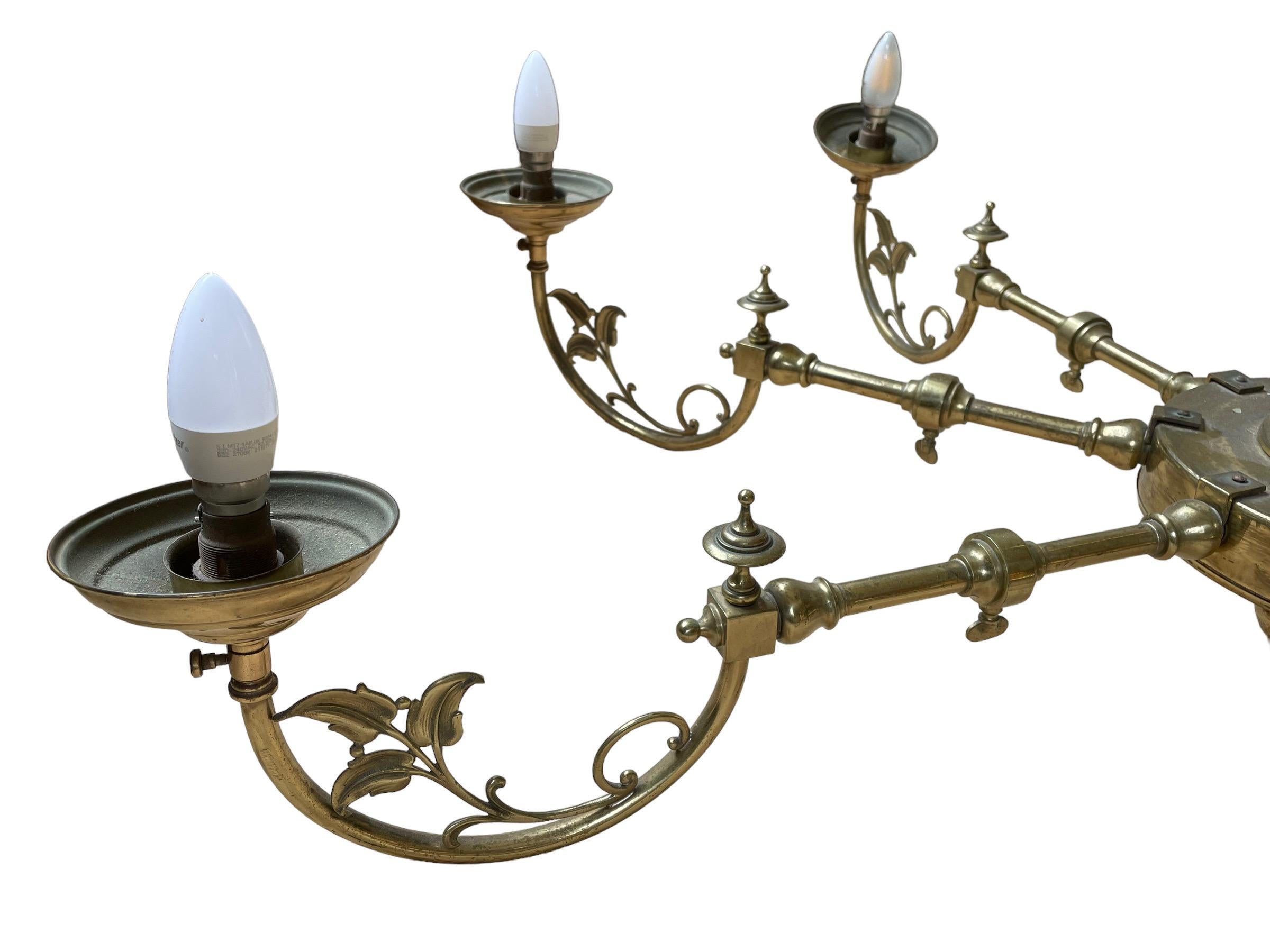 Liberty Style Chandelier Center Light

Made around the turn of the century incorporating Classical style with Art Nouveau influences, the eight branch arms centered with a substantial central boss.

Liberty style detailing with leaf feature 
Ideal